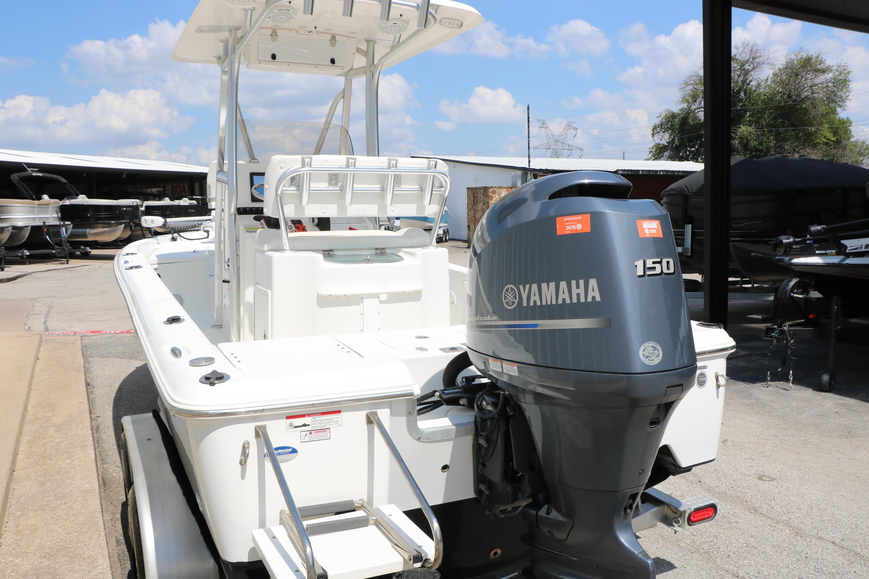 2015 Sea Hunt BX 22 BR boat with Yamaha 150 outboard motor, parked outdoors.