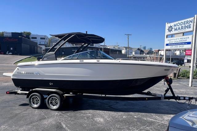 2025 Chaparral 247 SSX boat on trailer at Modern Marine dealership.