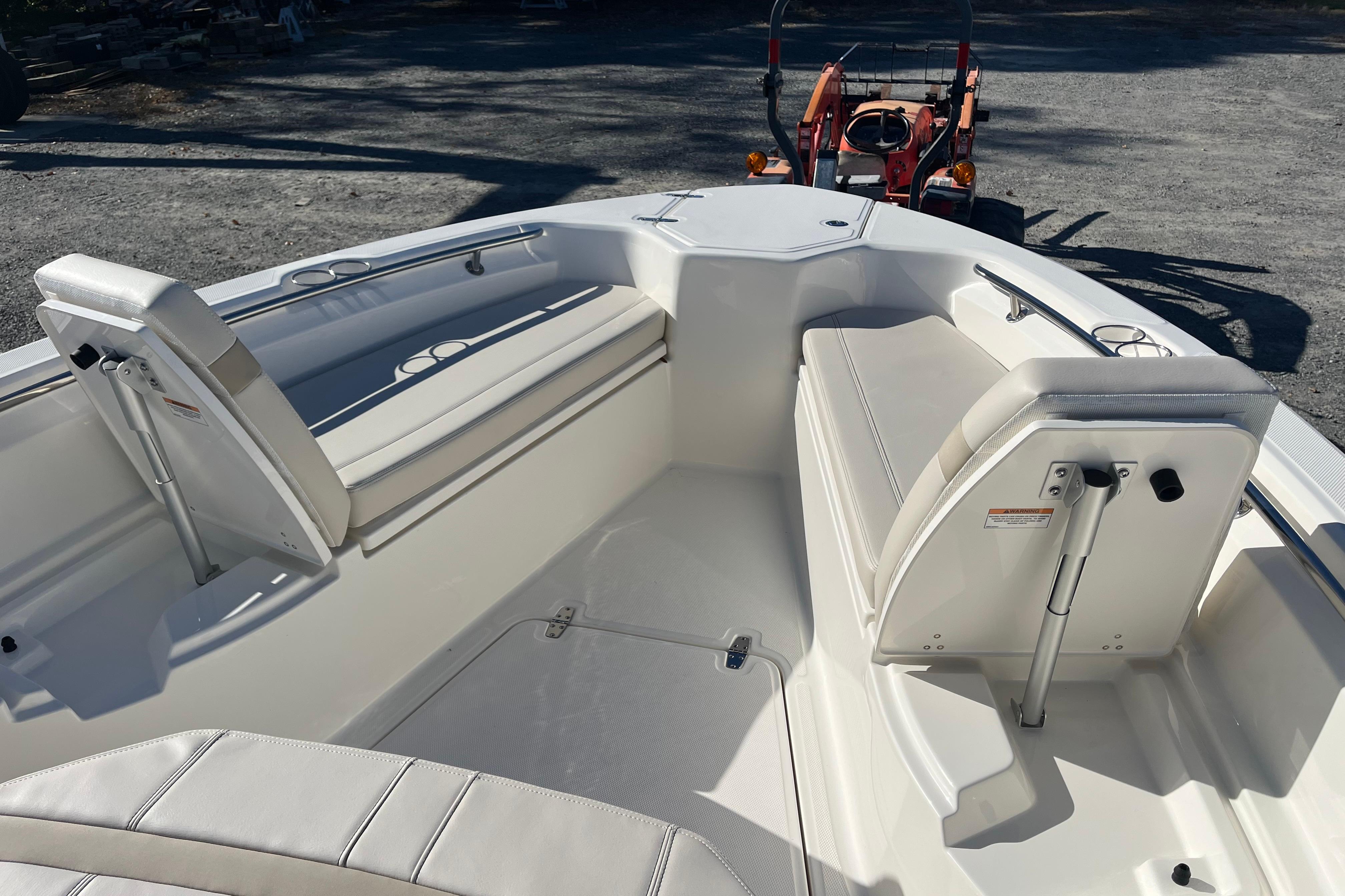 2026 Boston Whaler 280 Dauntless boat interior with white seating and sleek design.