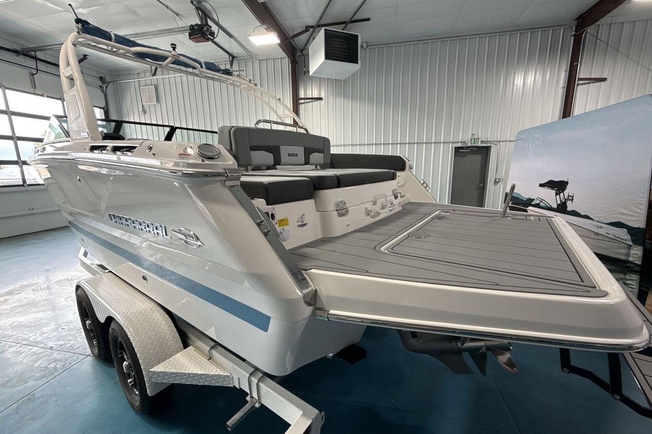 The image shows a 2026 Chaparral SSX 4 boat in a showroom.