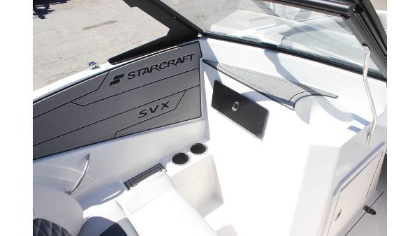 2025 Starcraft SVX 210 OB DC boat interior with sleek design and cup holders.