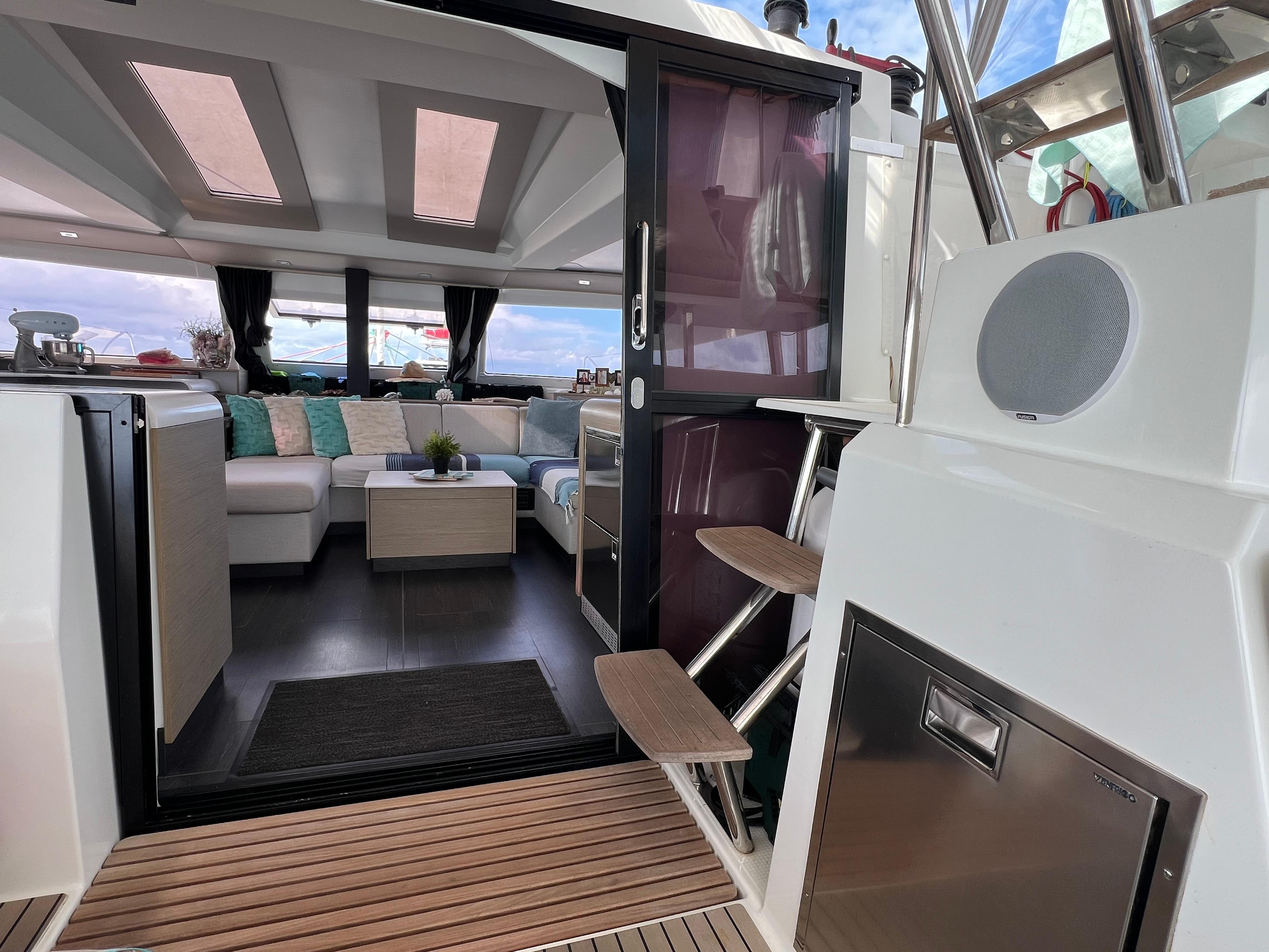 Luxurious interior of 2022 Fountaine Pajot Elba 45 catamaran with modern seating and sleek design.