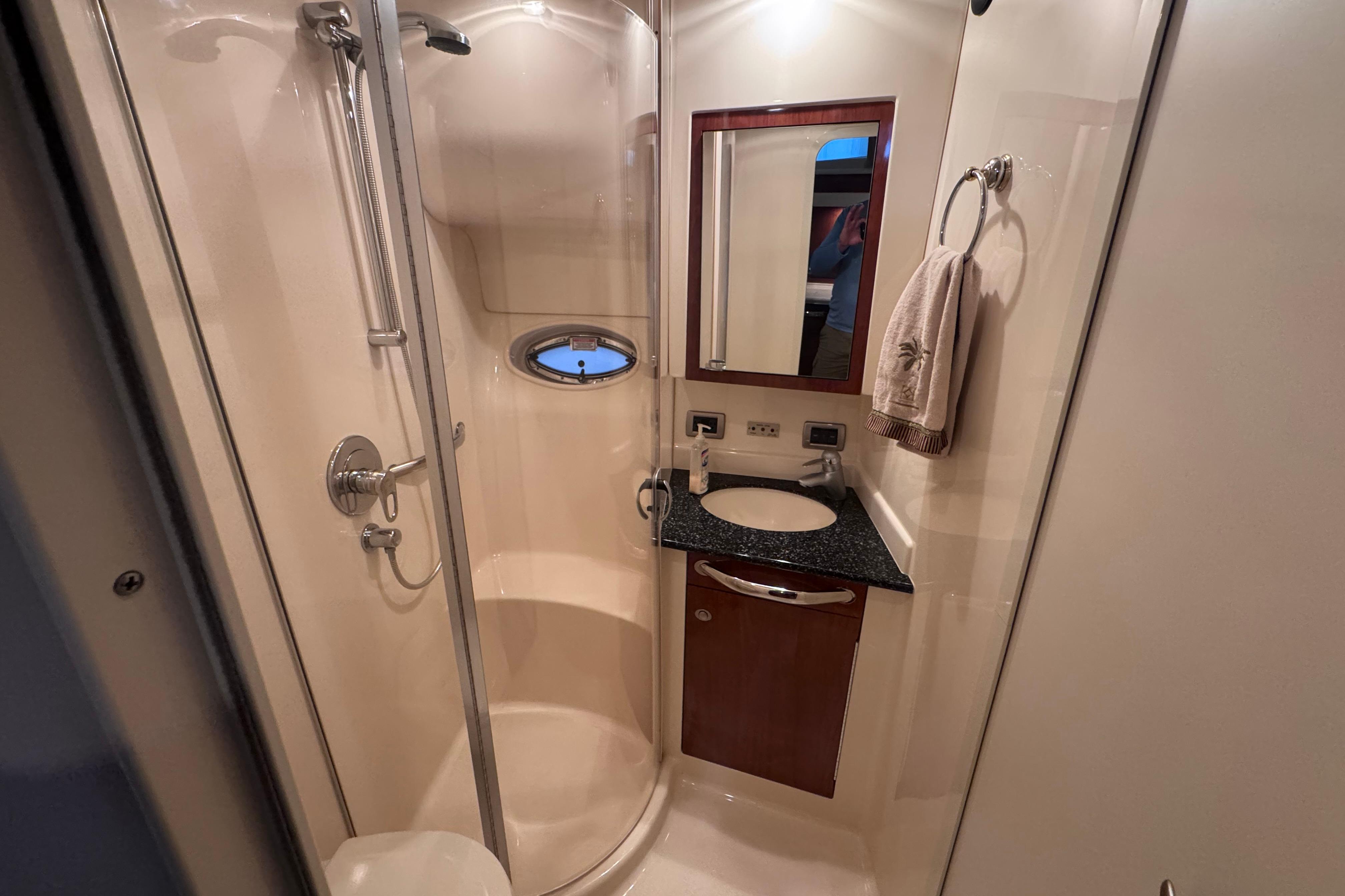 Luxurious bathroom in 2004 Sea Ray 390 Motor Yacht with shower and vanity.