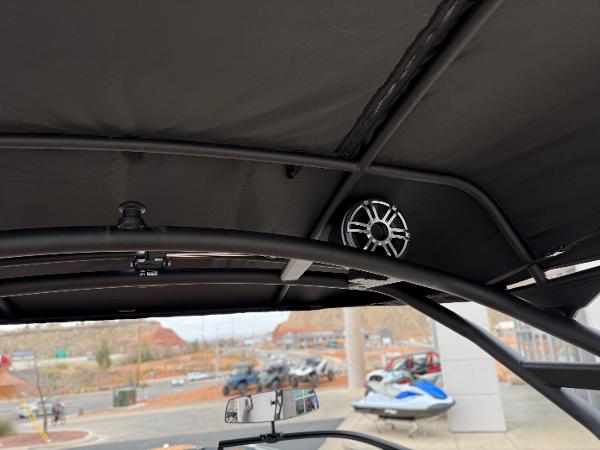2025 Yamaha Boats 255XD interior with speaker and canopy view.