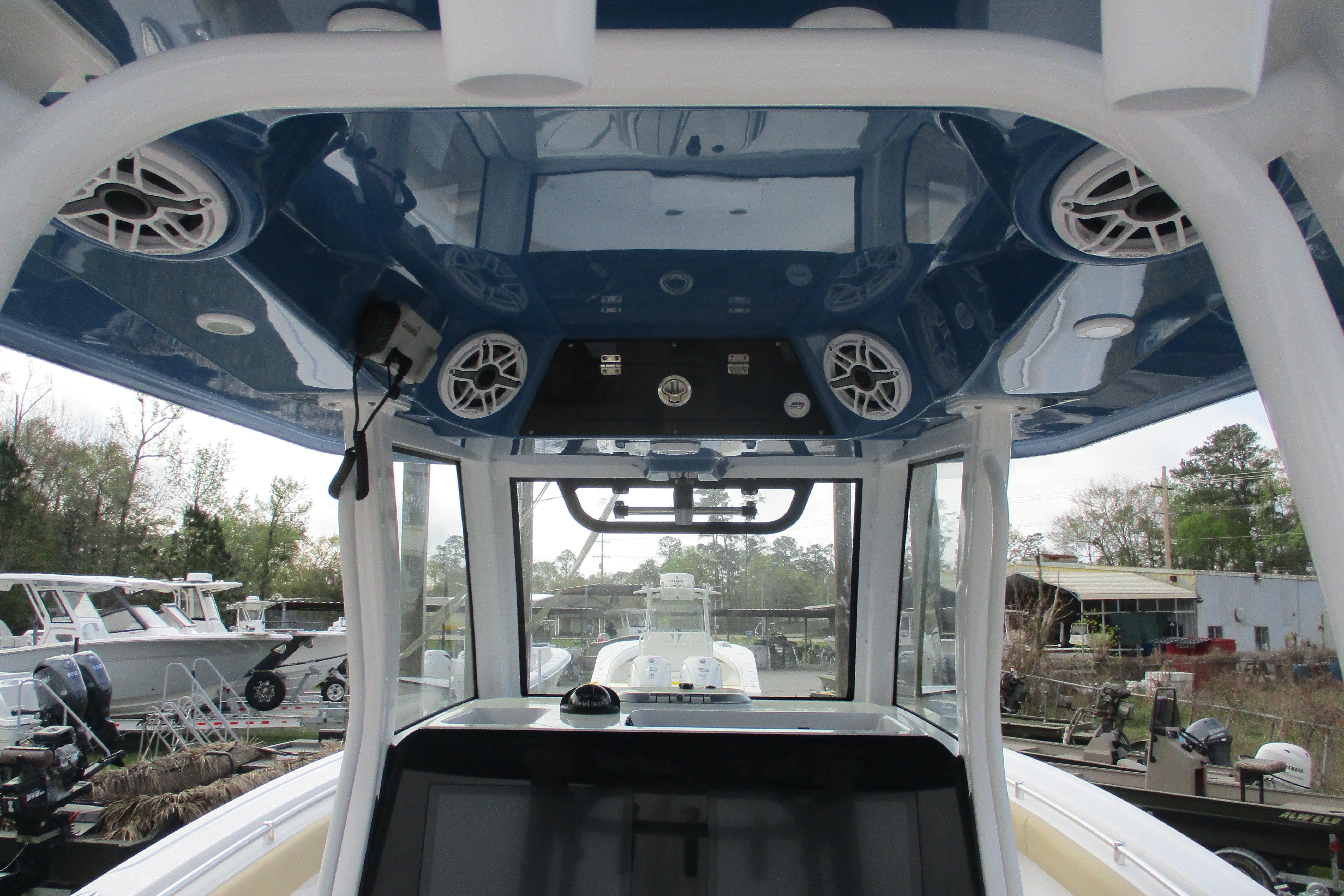 2026 Sportsman Open 302 Center Console boat interior with speakers and control panel.