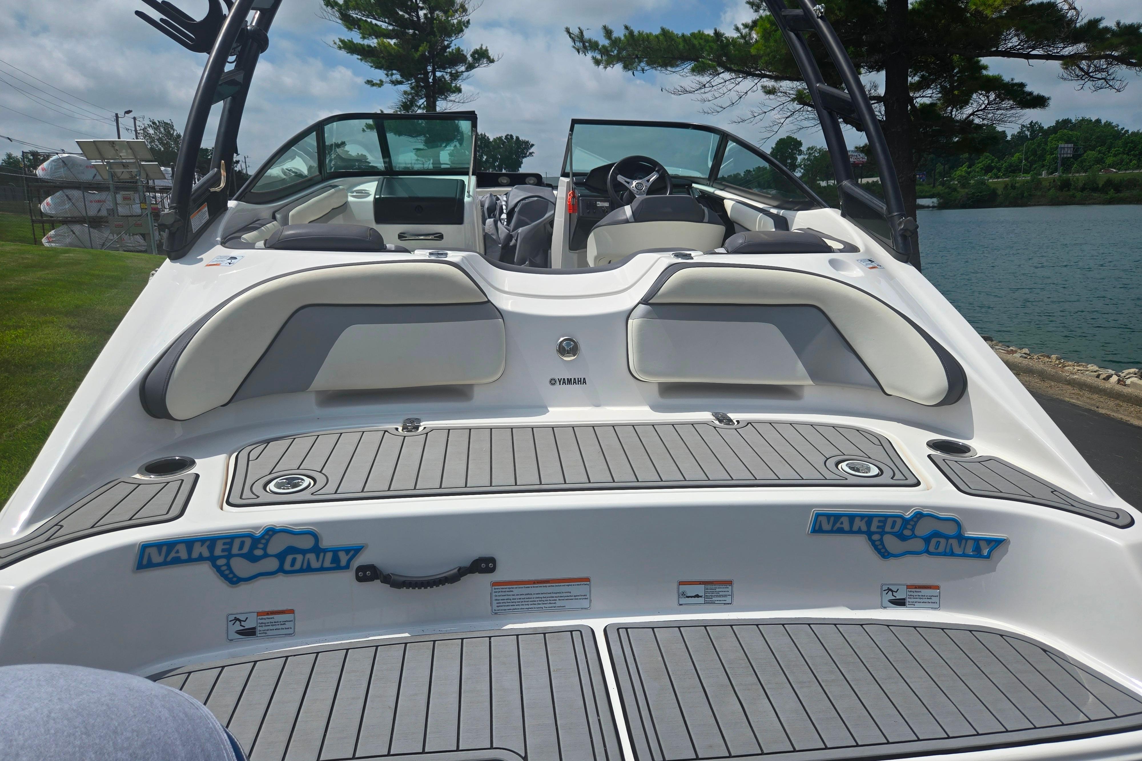 2016 Yamaha Boats AR192 with open cockpit, docked by a scenic lake.
