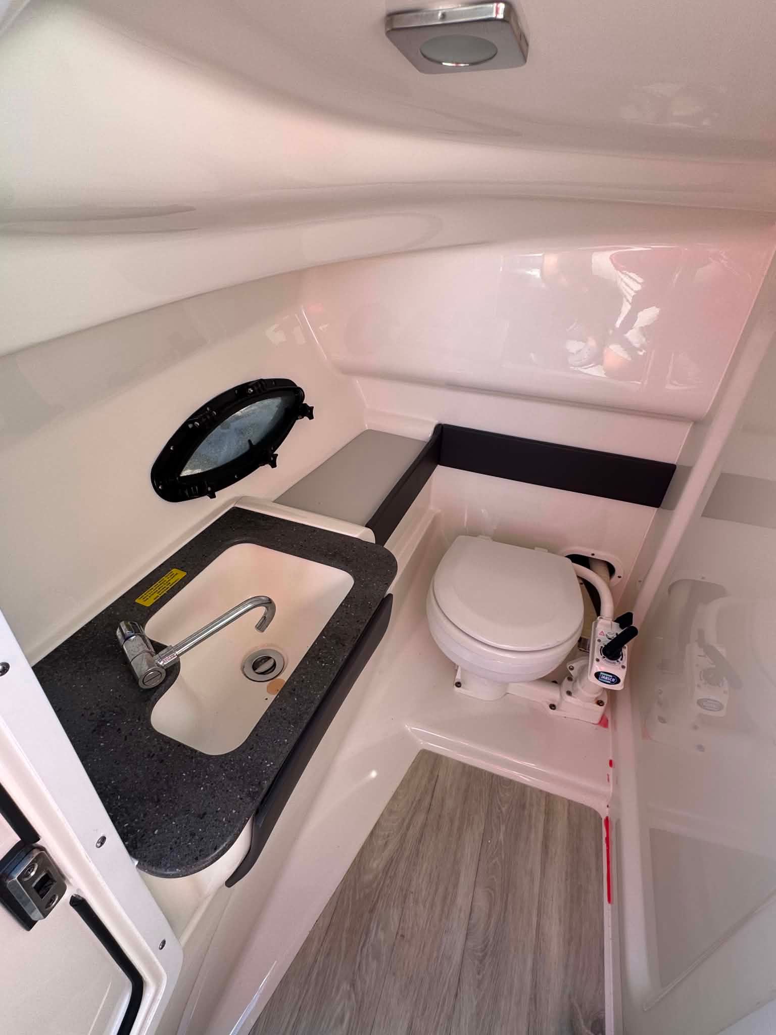 Interior of a 2018 Formula 270 Bowrider yacht with toilet and sink.
