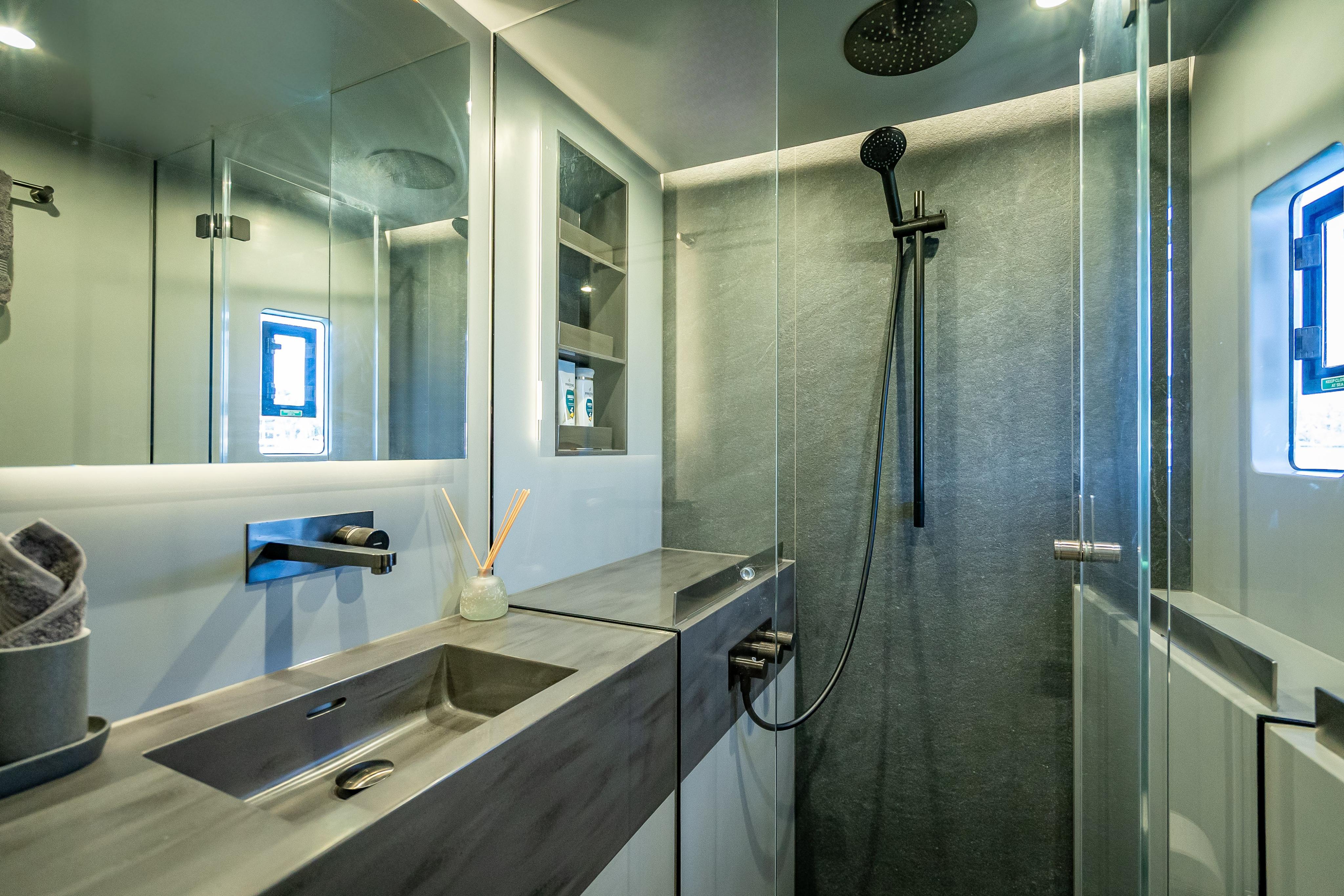Luxurious bathroom in 2026 Sunreef 60 Power yacht with modern fixtures and sleek design.