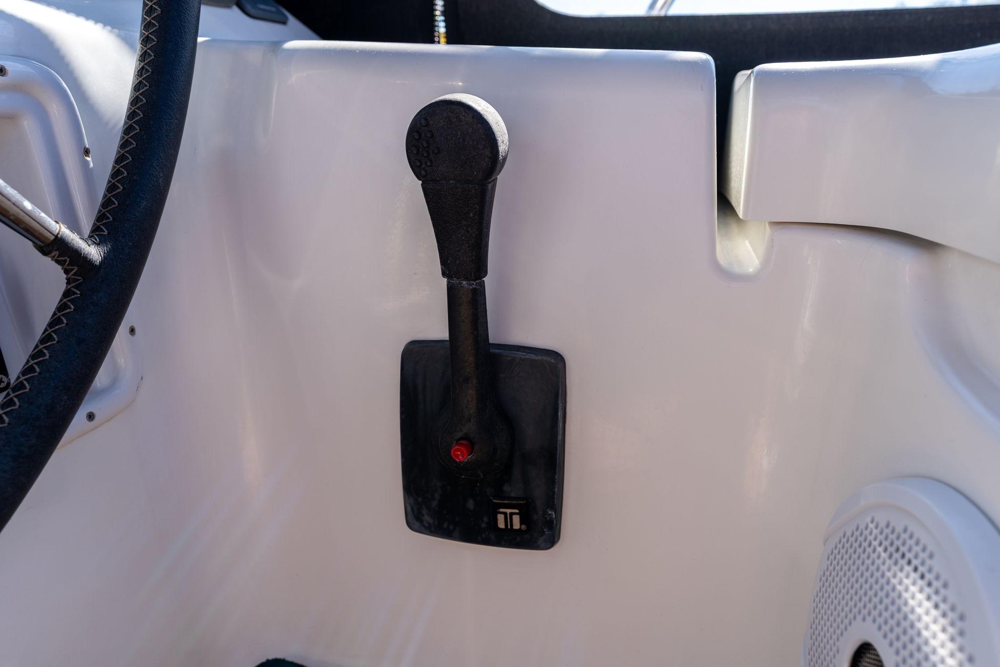 Throttle control lever on a 2013 Beneteau Oceanis 50 sailboat cockpit.