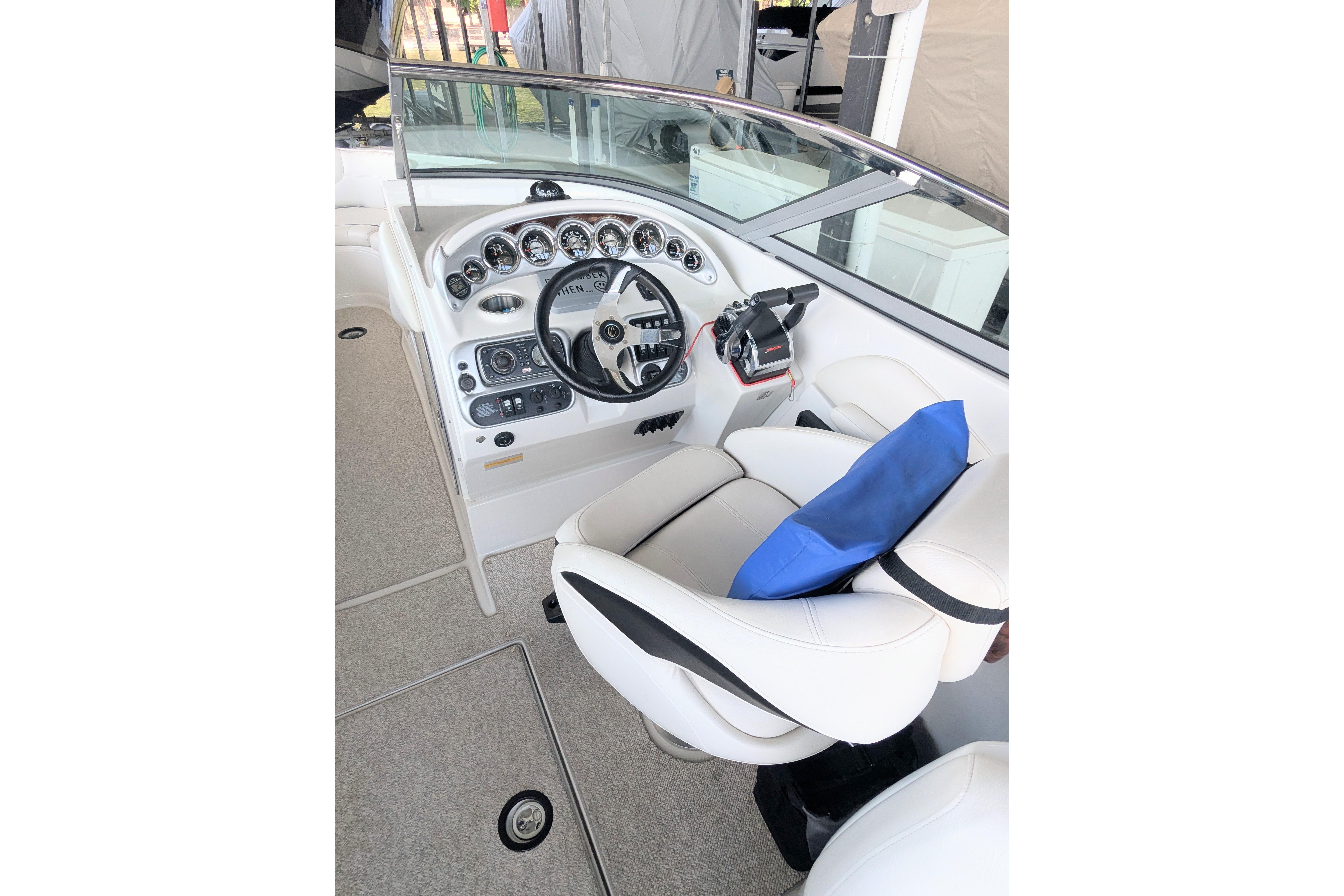 2008 Crownline 300 LS boat cockpit with steering wheel and control panel.