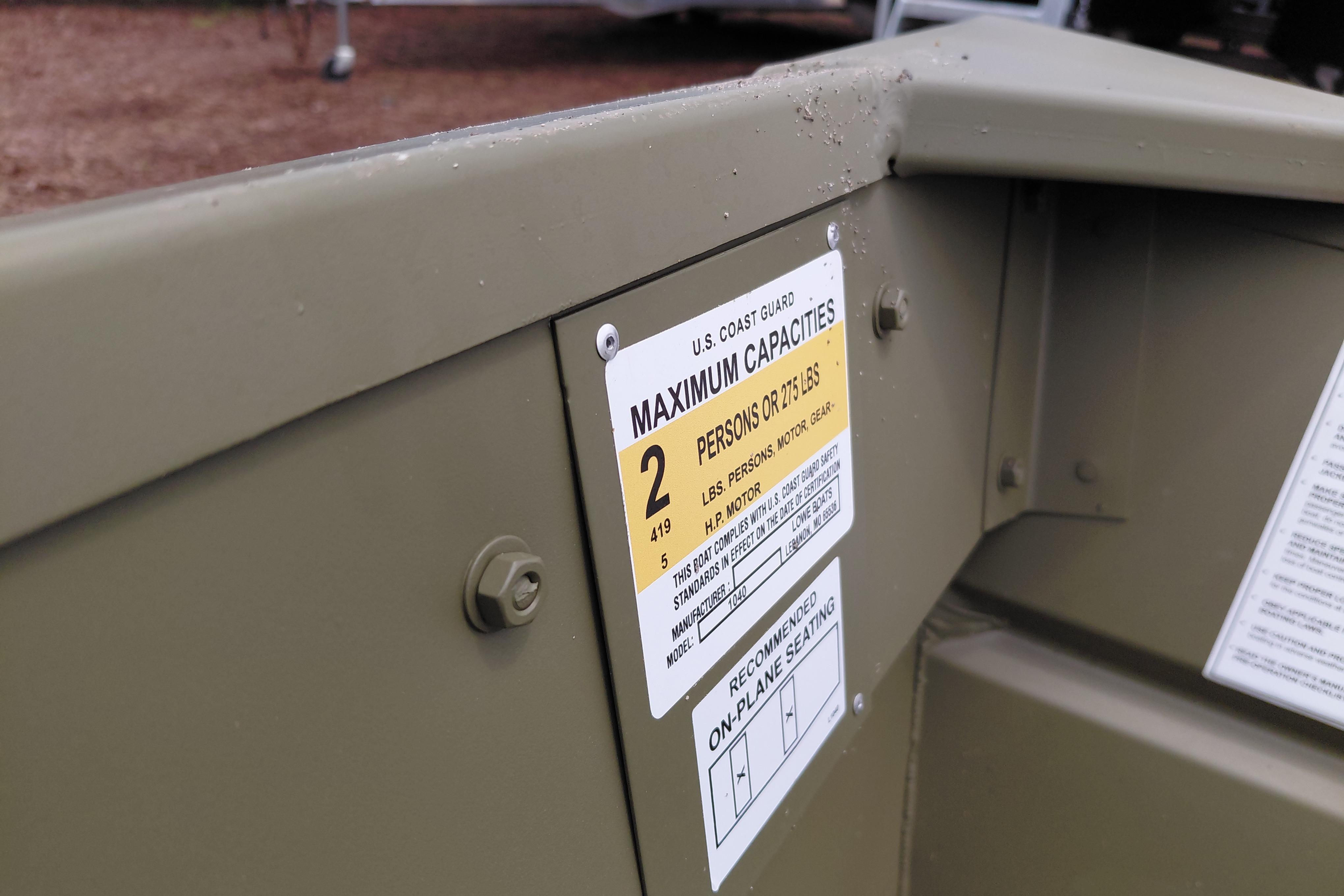 2025 Lowe L1040 Jon boat capacity label, indicating maximum of 2 persons or 275 lbs.