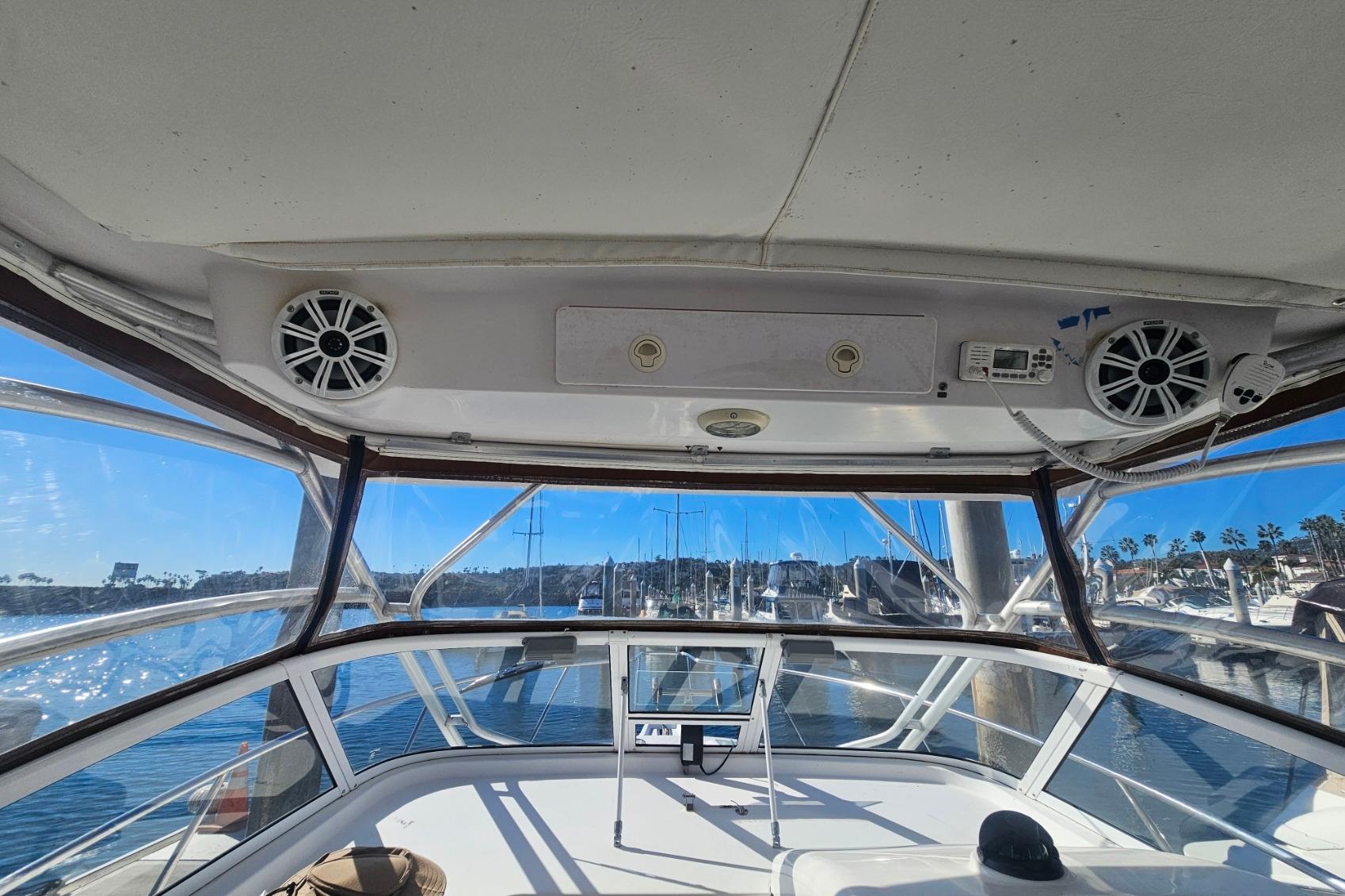 Interior view of 2006 Pro-Line 32 Express boat with clear windows and speakers.