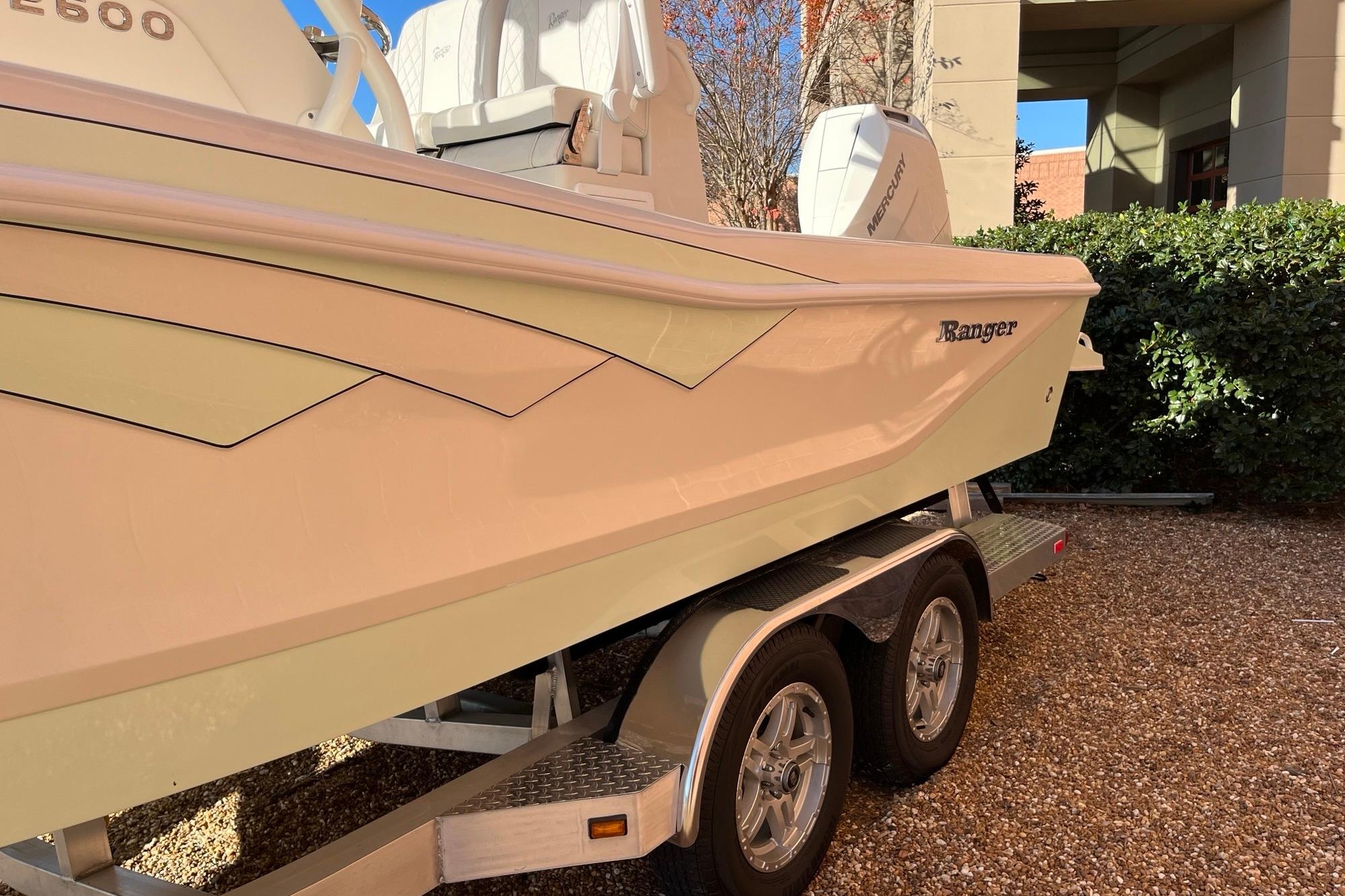 2024 Ranger 2600 Bay boat on trailer, side view, outdoors.