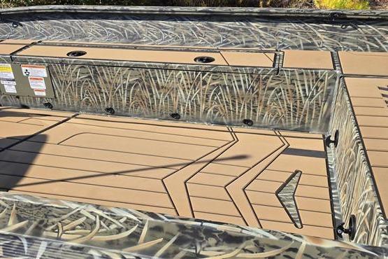 2026 Tracker Grizzly 1756 T Marsh boat interior with camouflage design and tan decking.