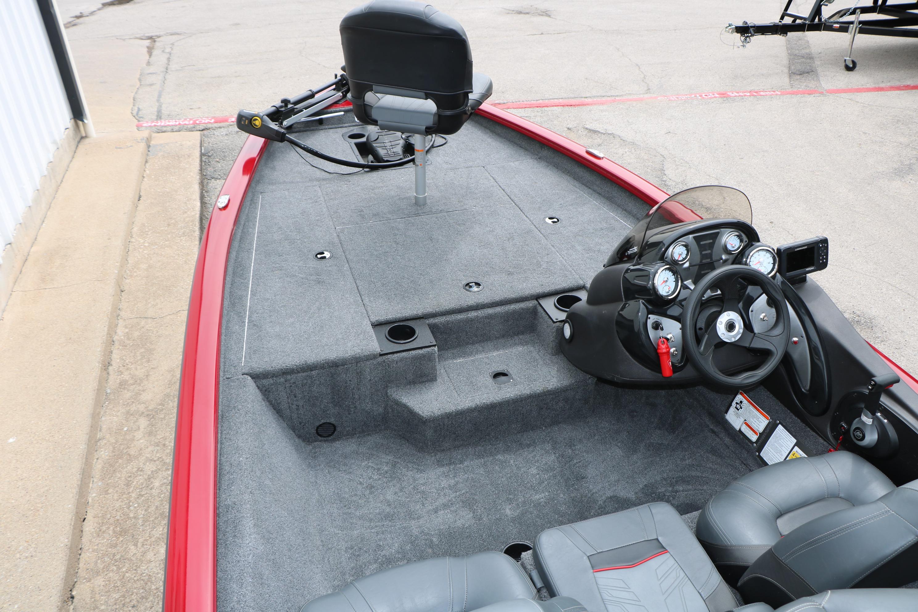 2024 Tracker Pro Team 175 boat interior with steering console and seating.