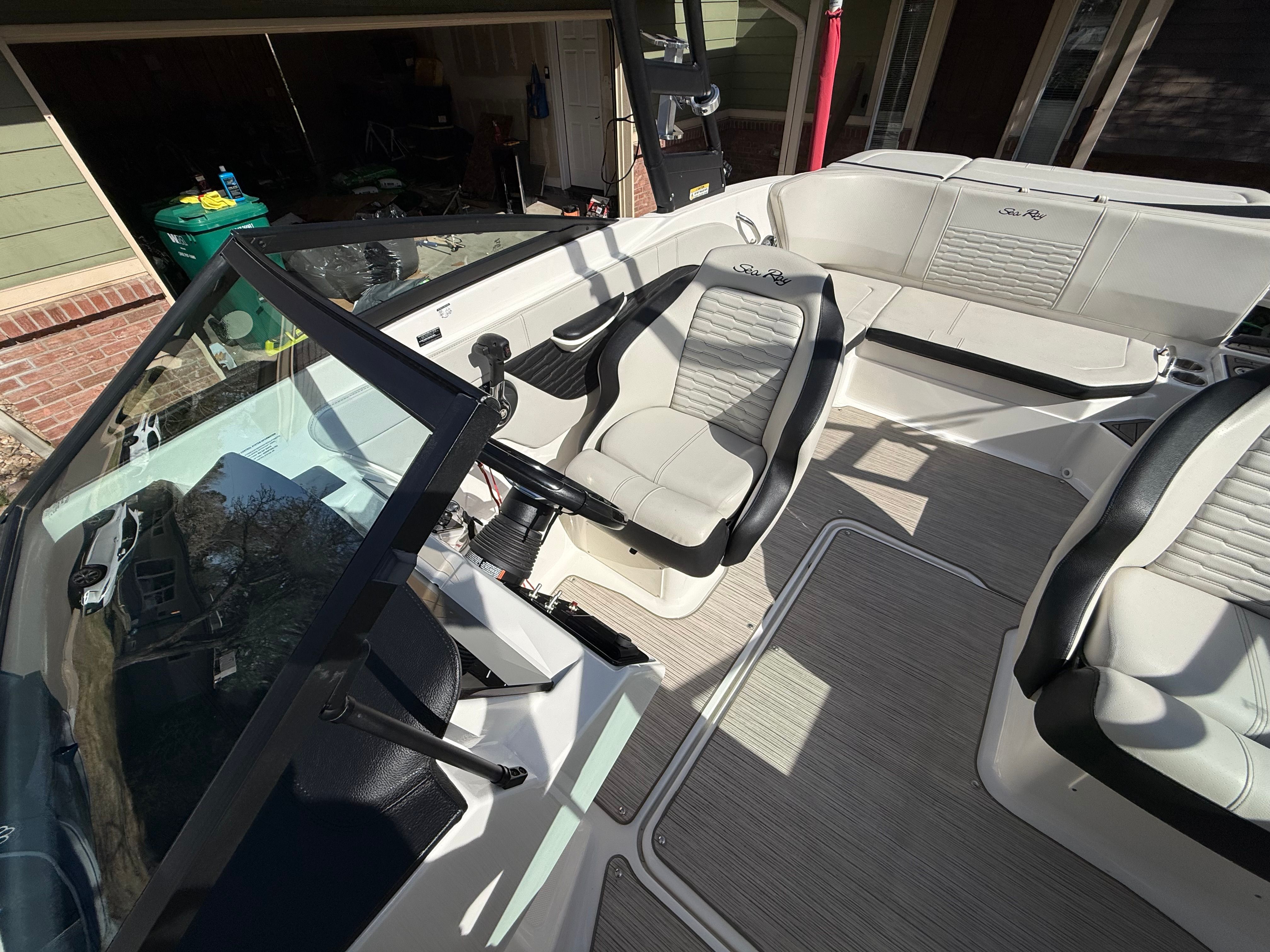 Interior of a 2022 Sea Ray SPX 210 boat with modern seating.