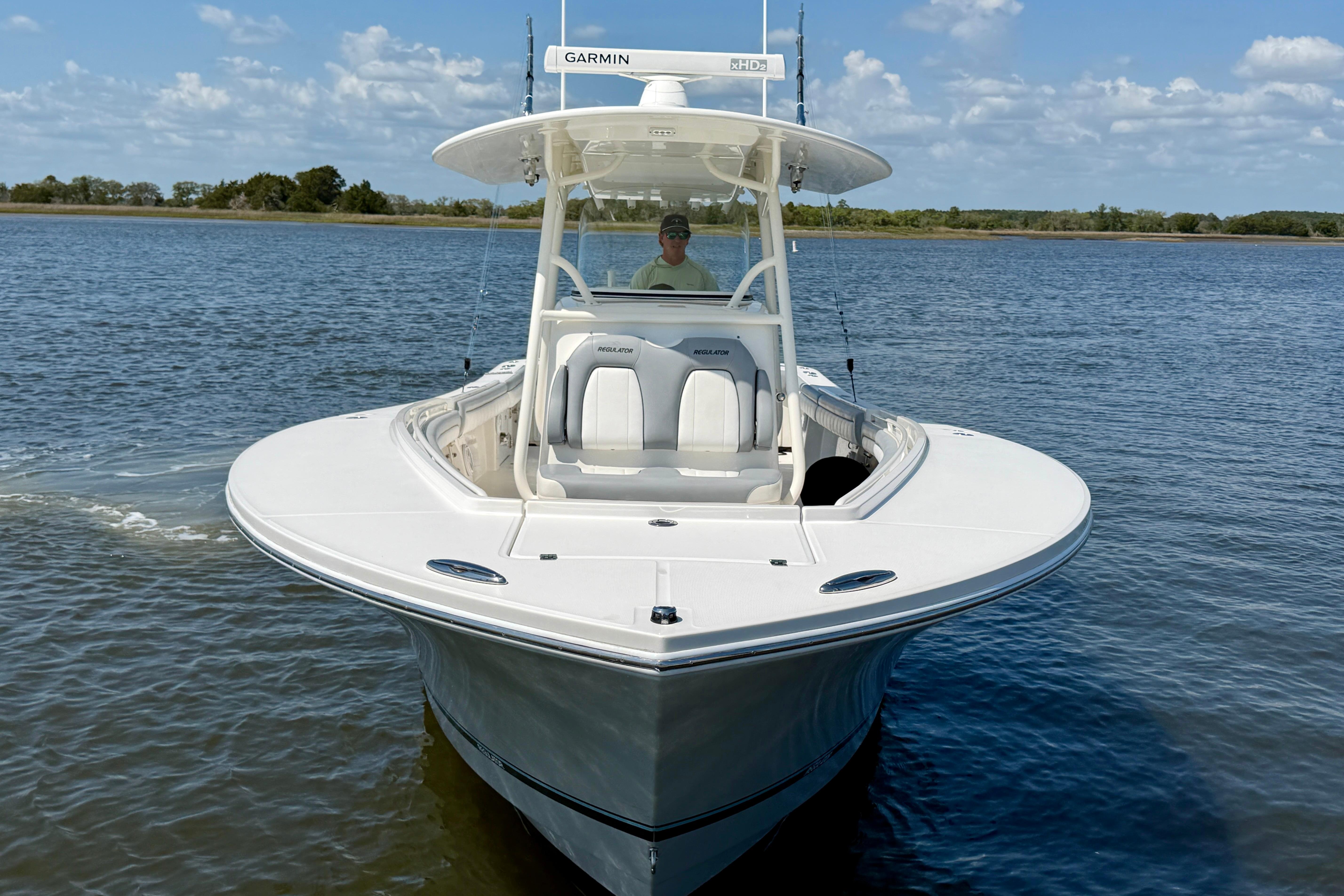 2019 Regulator 31 boat on calm water under a clear sky.