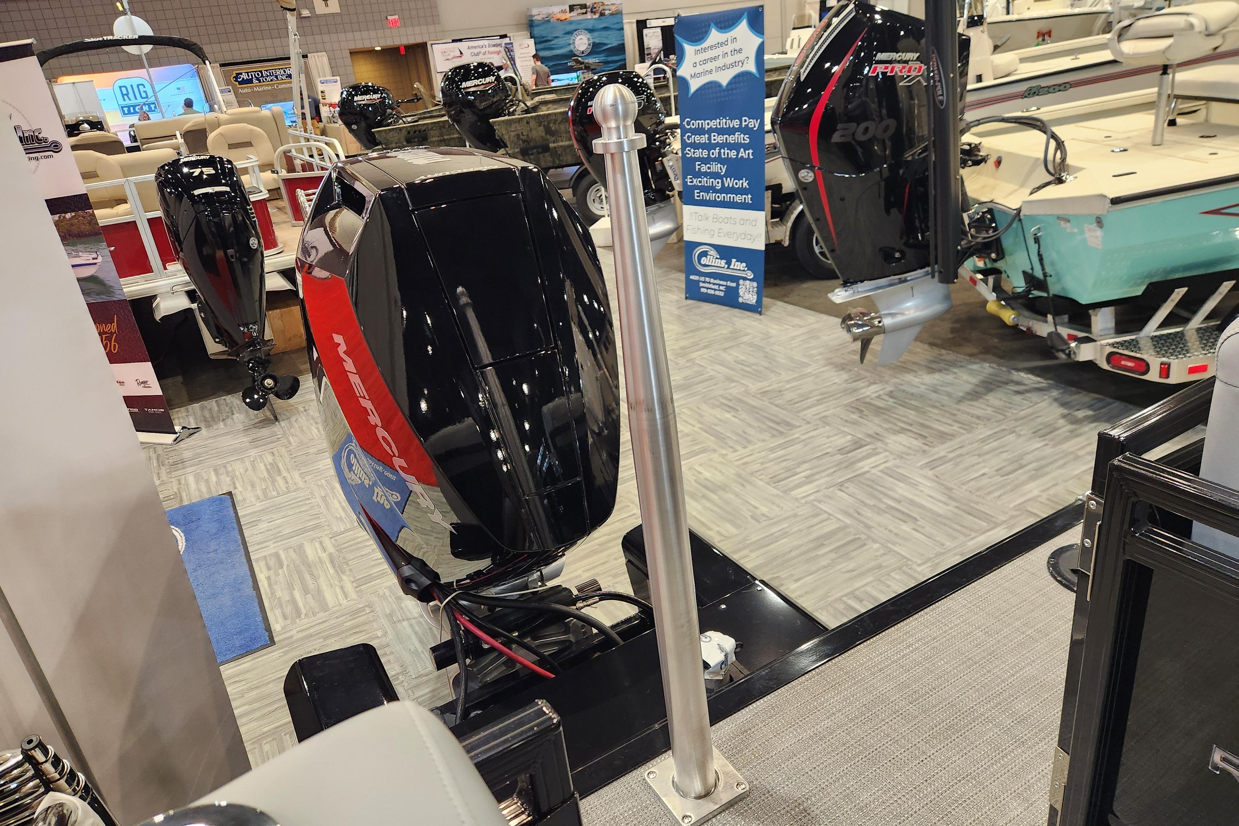 Boat show display featuring 2025 Regency 250 LE3 with Mercury outboard engines.