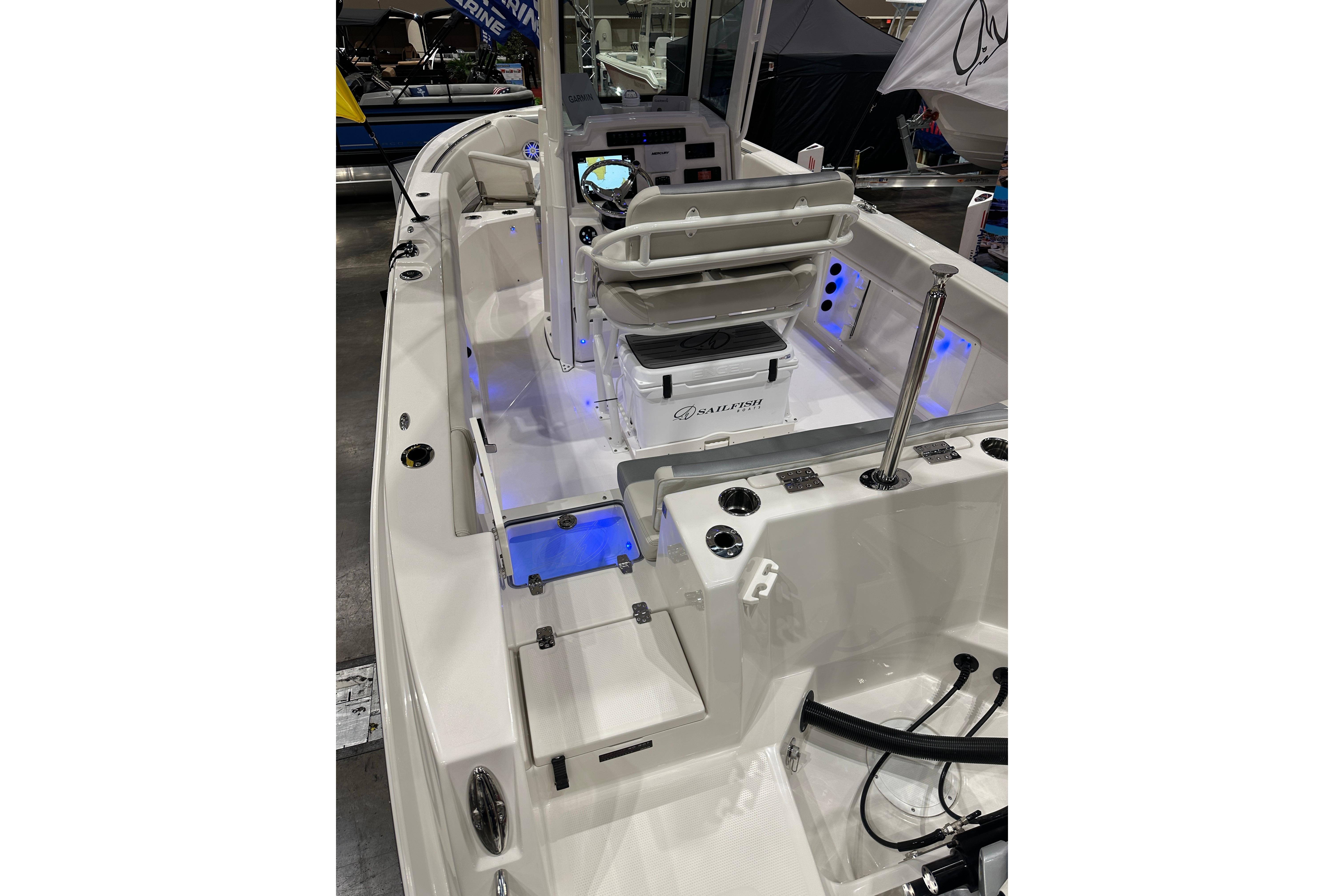 2026 Sailfish 232 CC boat interior with modern console and seating, featuring blue LED lighting.