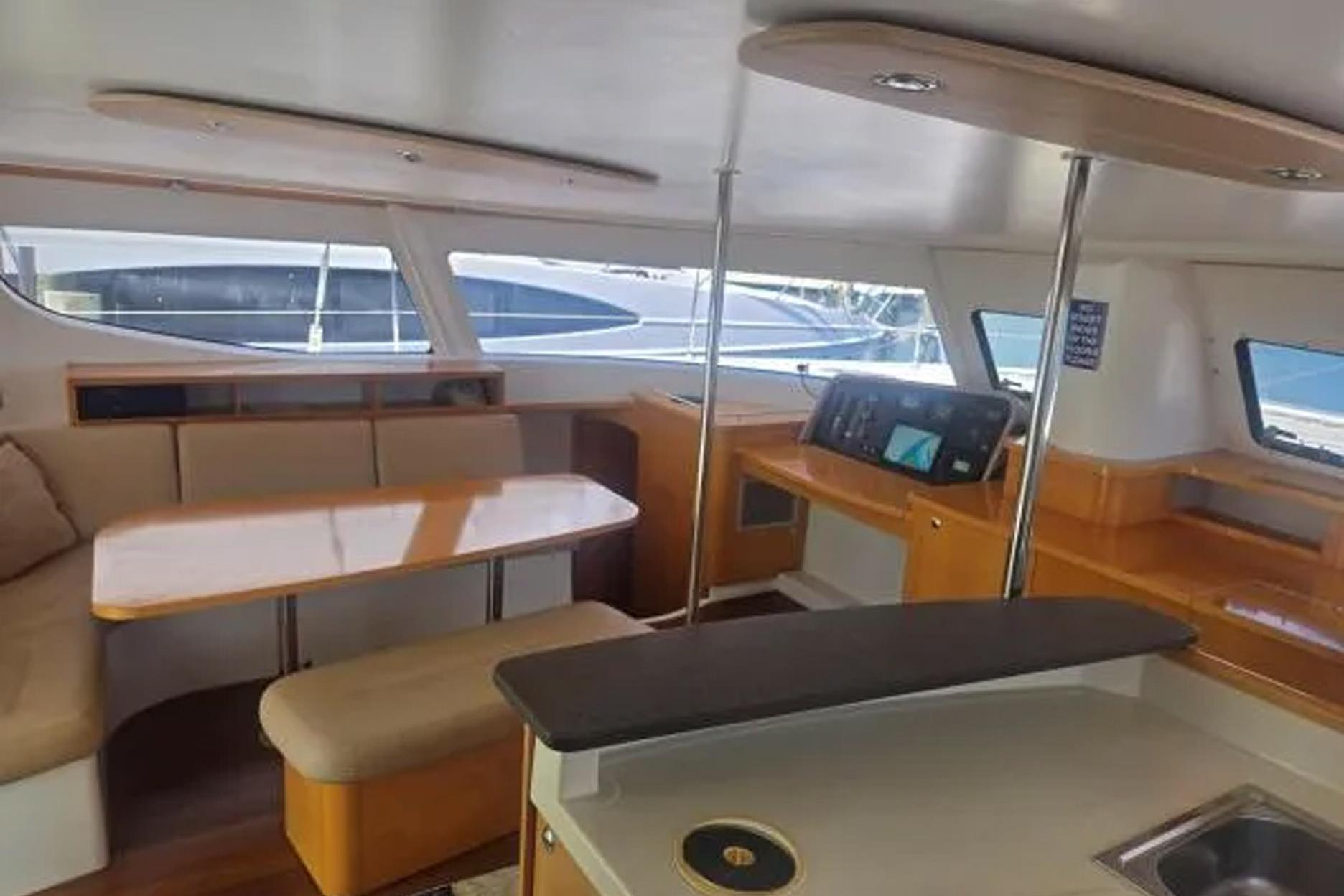 Interior of 2008 Fountaine Pajot Salina 48 catamaran with modern seating and navigation area.