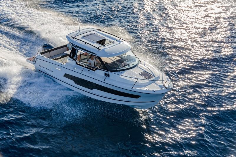 2023 Jeanneau NC795 S2 cruising on sparkling blue water.
