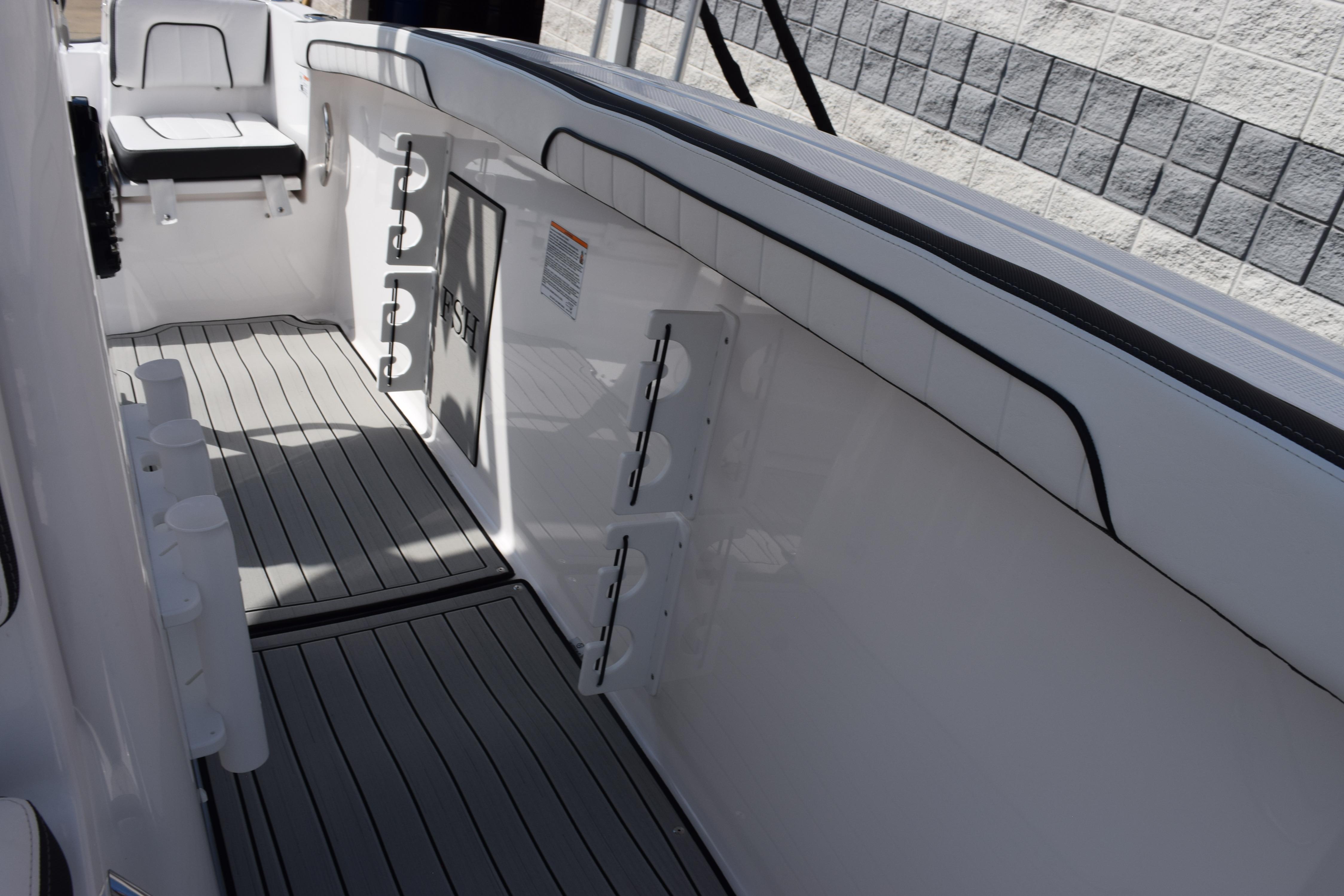 2026 Yamaha Boats 255 FSH Sport H interior with sleek seating and rod holders.