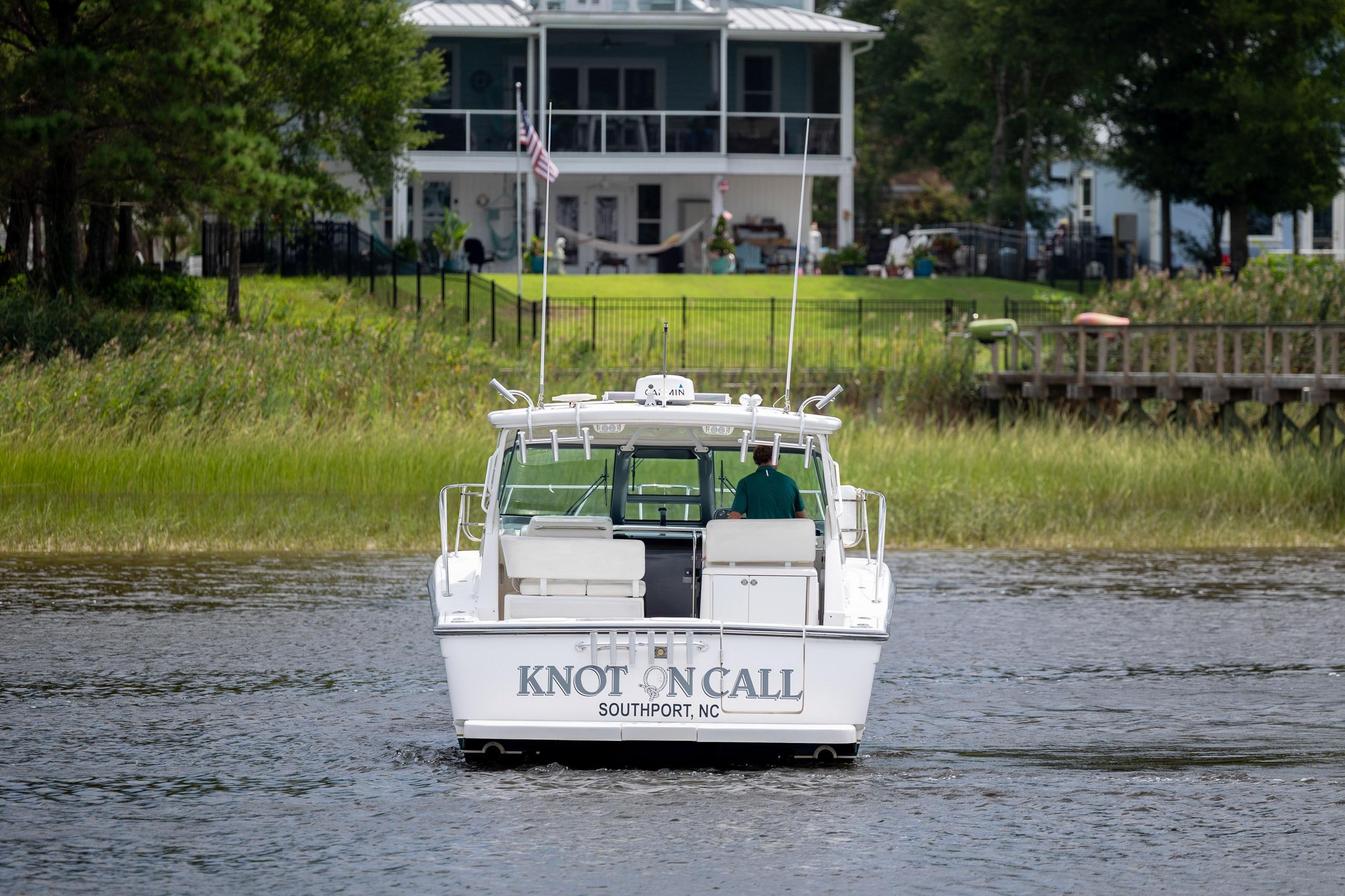 2004 Tiara Yachts 3200 Open boat on water near a house, Southport, NC.