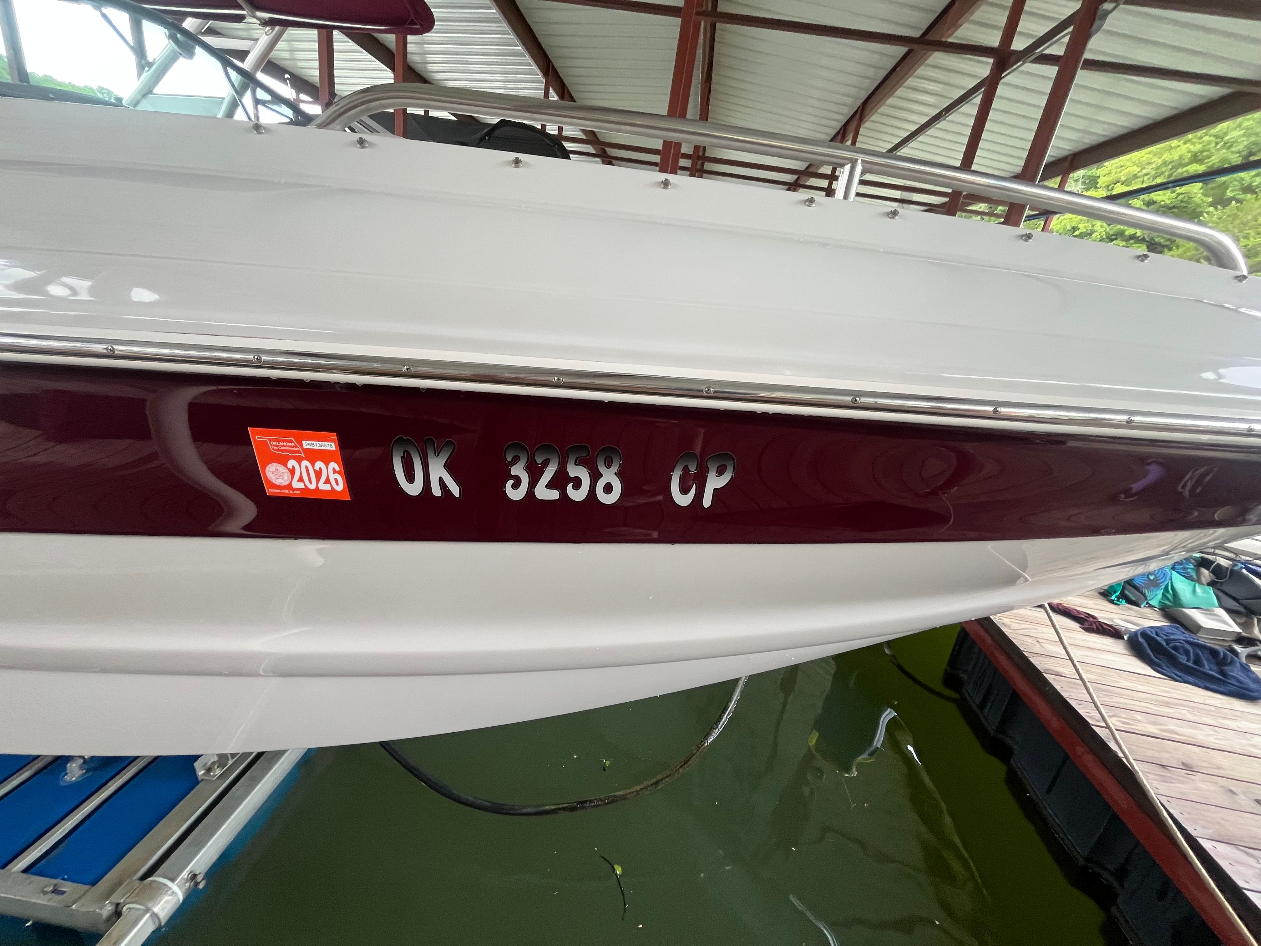 A 2008 Crownline 252EX boat is docked on the water.