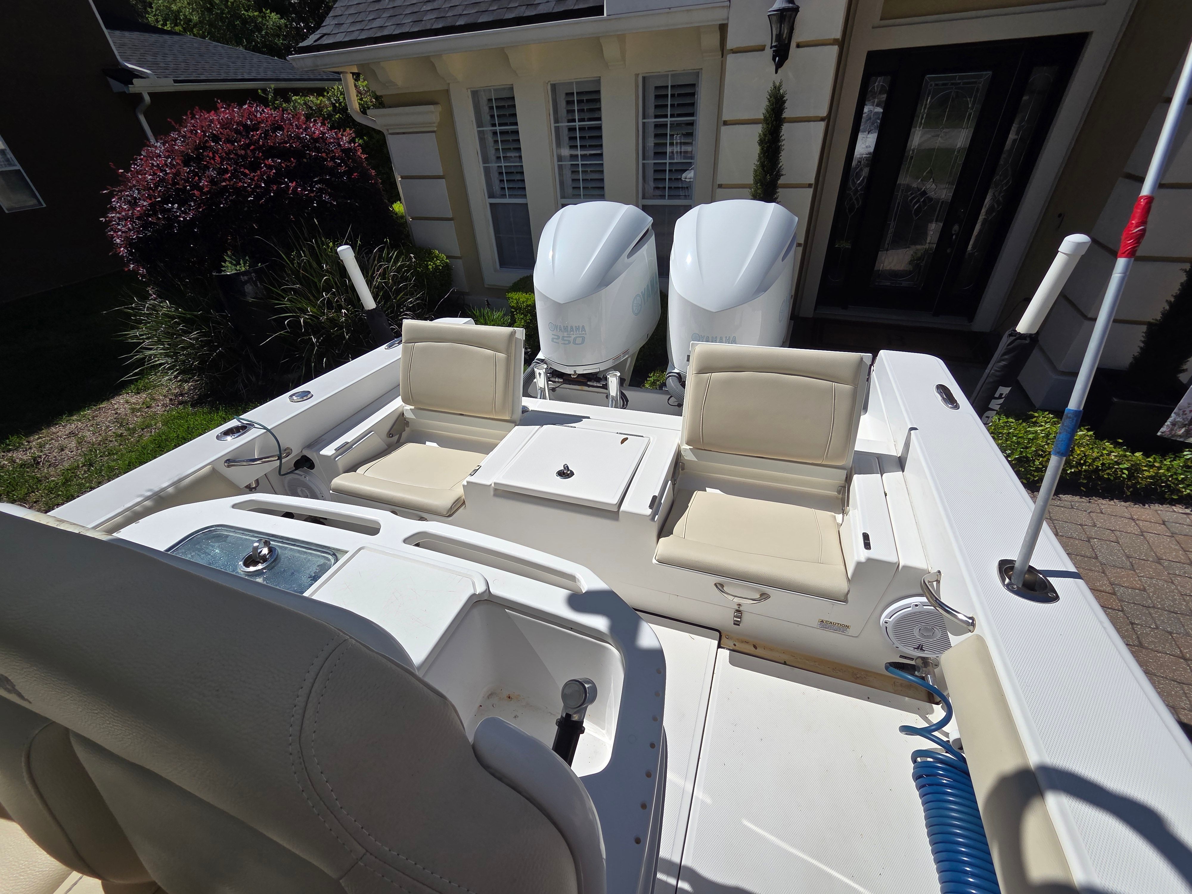 The image shows the cockpit of a 2017 Everglades 273 Center Console boat with two engines.