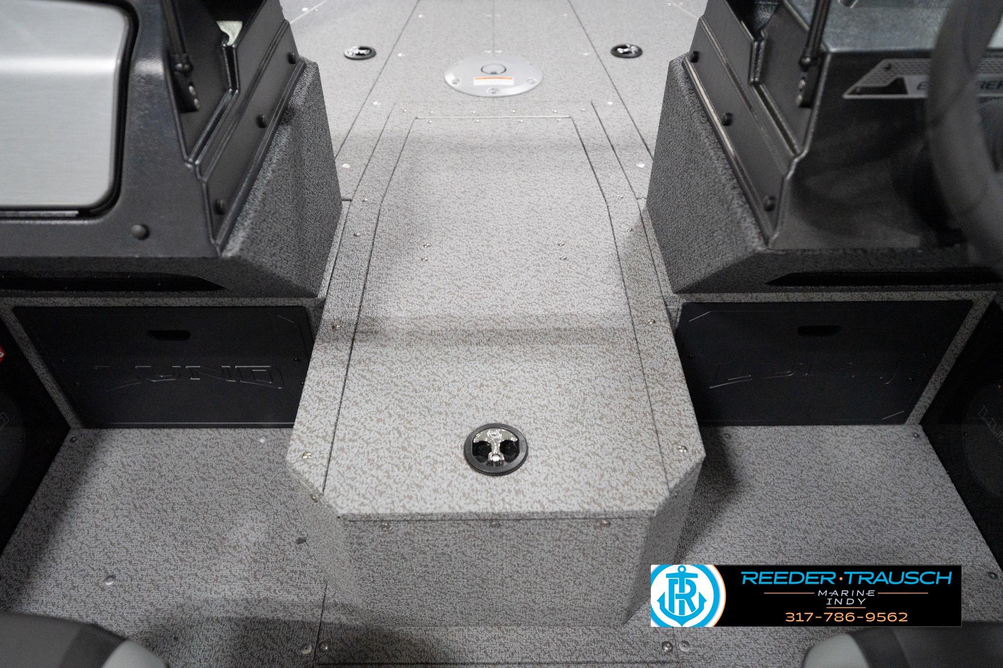 2026 Lund 1800 Explorer Sport boat interior with gray textured flooring and console details.