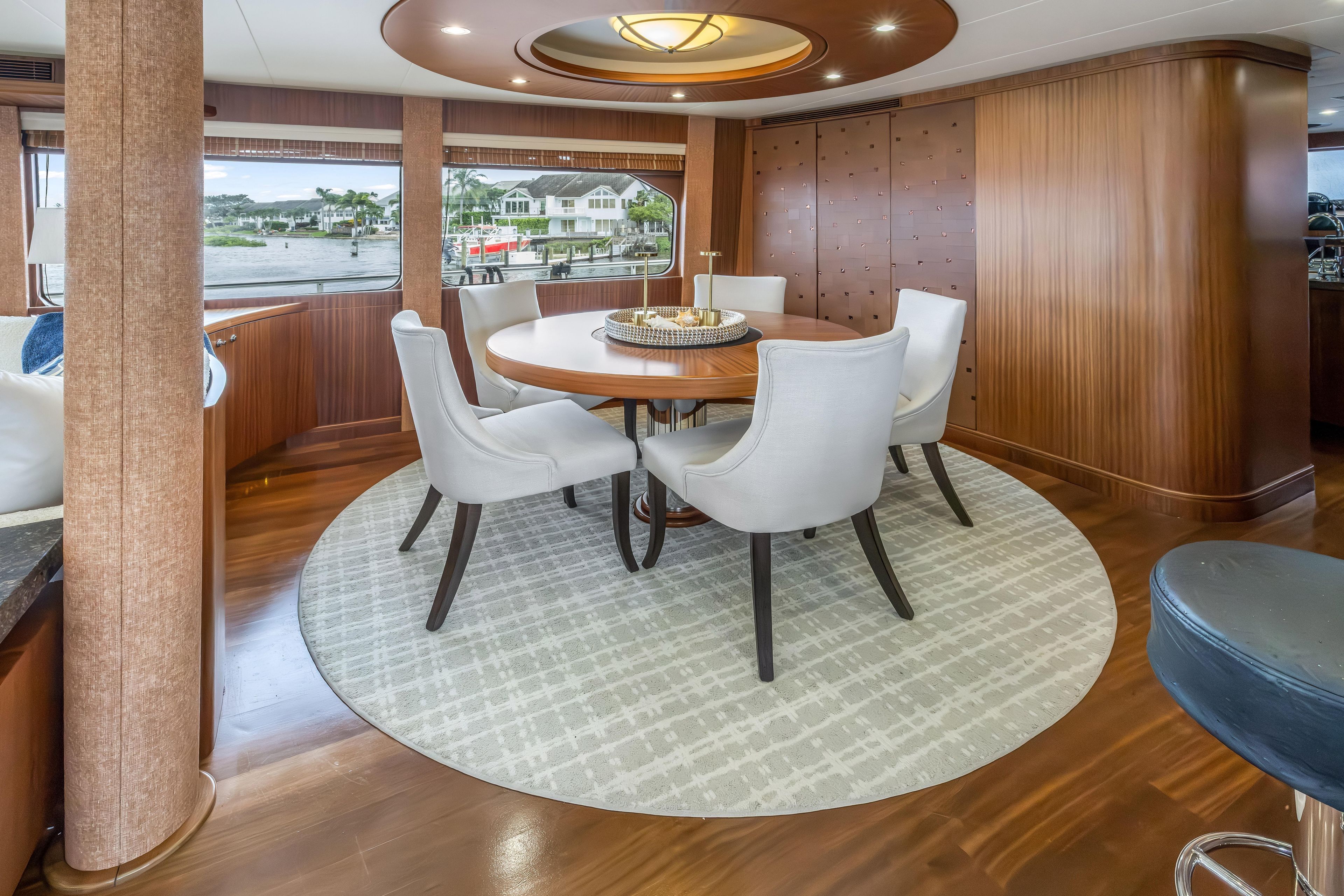 Luxurious dining area on 2012 Cheoy Lee 84 Bravo yacht with elegant furnishings.