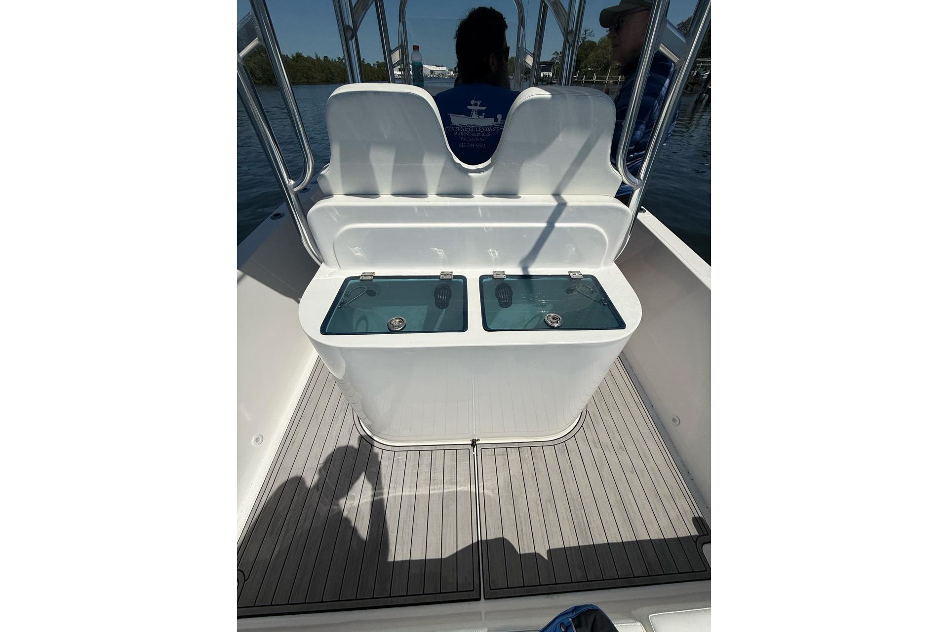 2021 Custom Infusion 34 CC boat interior with dual livewells on deck.