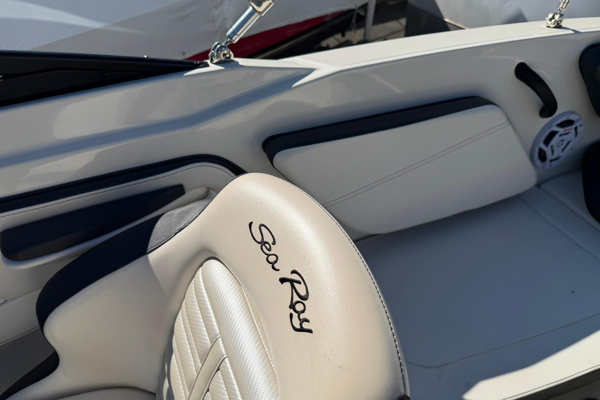 Interior of a 2016 Sea Ray SPX 210 boat, featuring branded seating.