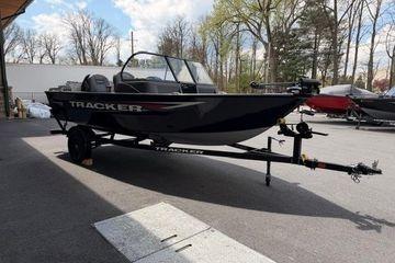 2026 Tracker Pro Guide V-16 WT boat on trailer, parked outdoors.