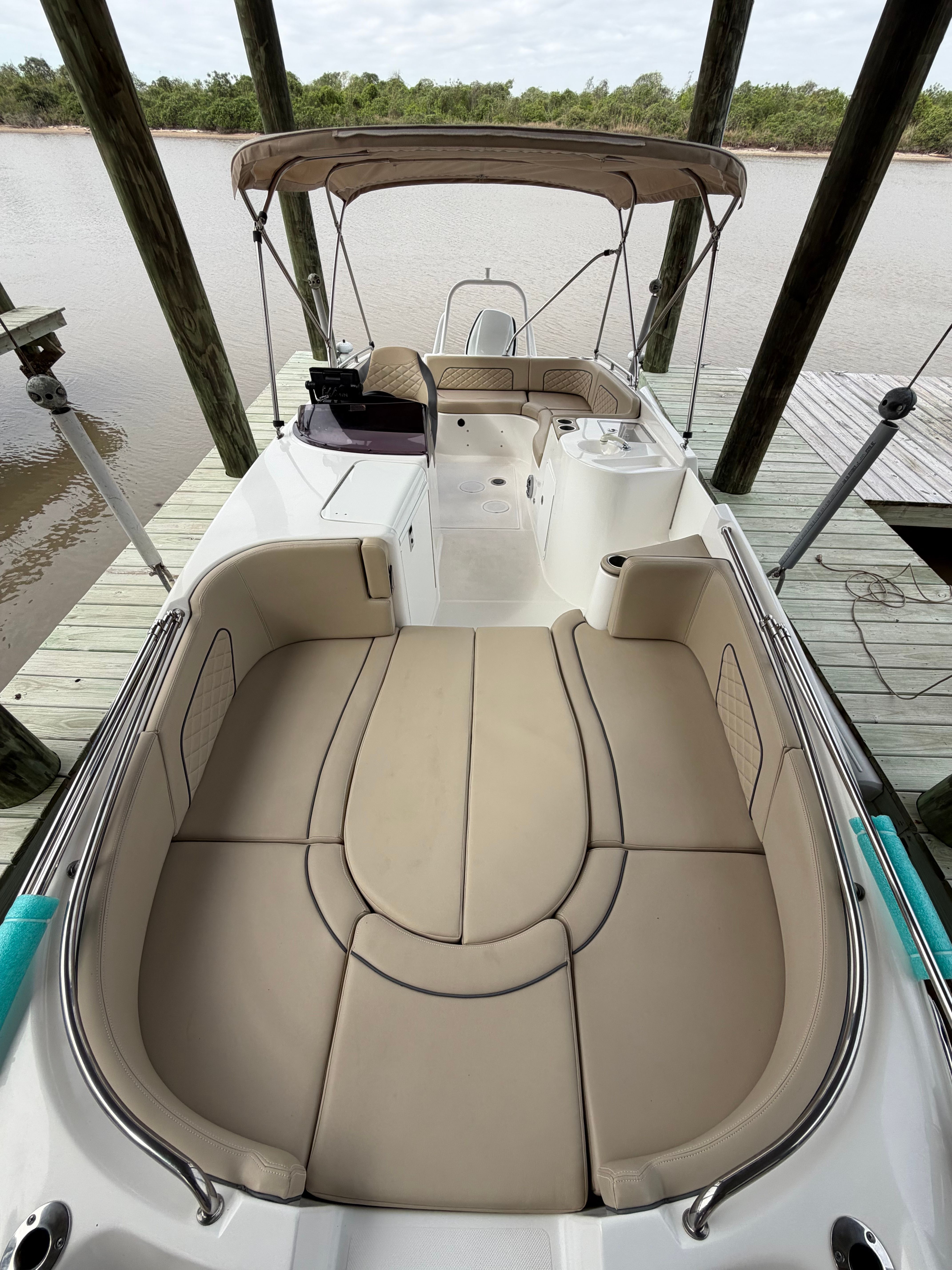 2021 Sea Pro Citation boat at dock with cushioned seating.