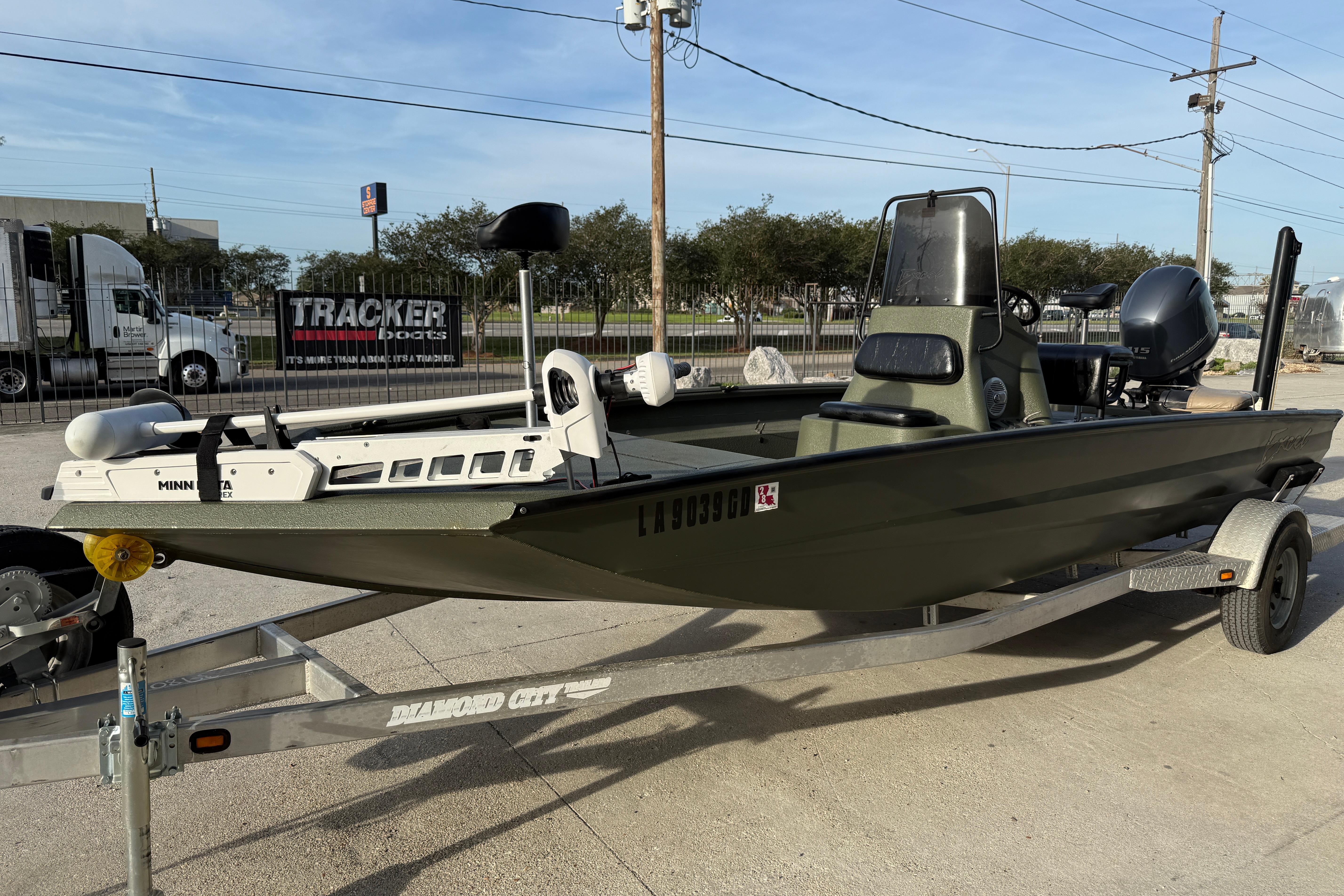 2014 Excel 203 Bay Pro boat on trailer, featuring Minn Kota trolling motor.