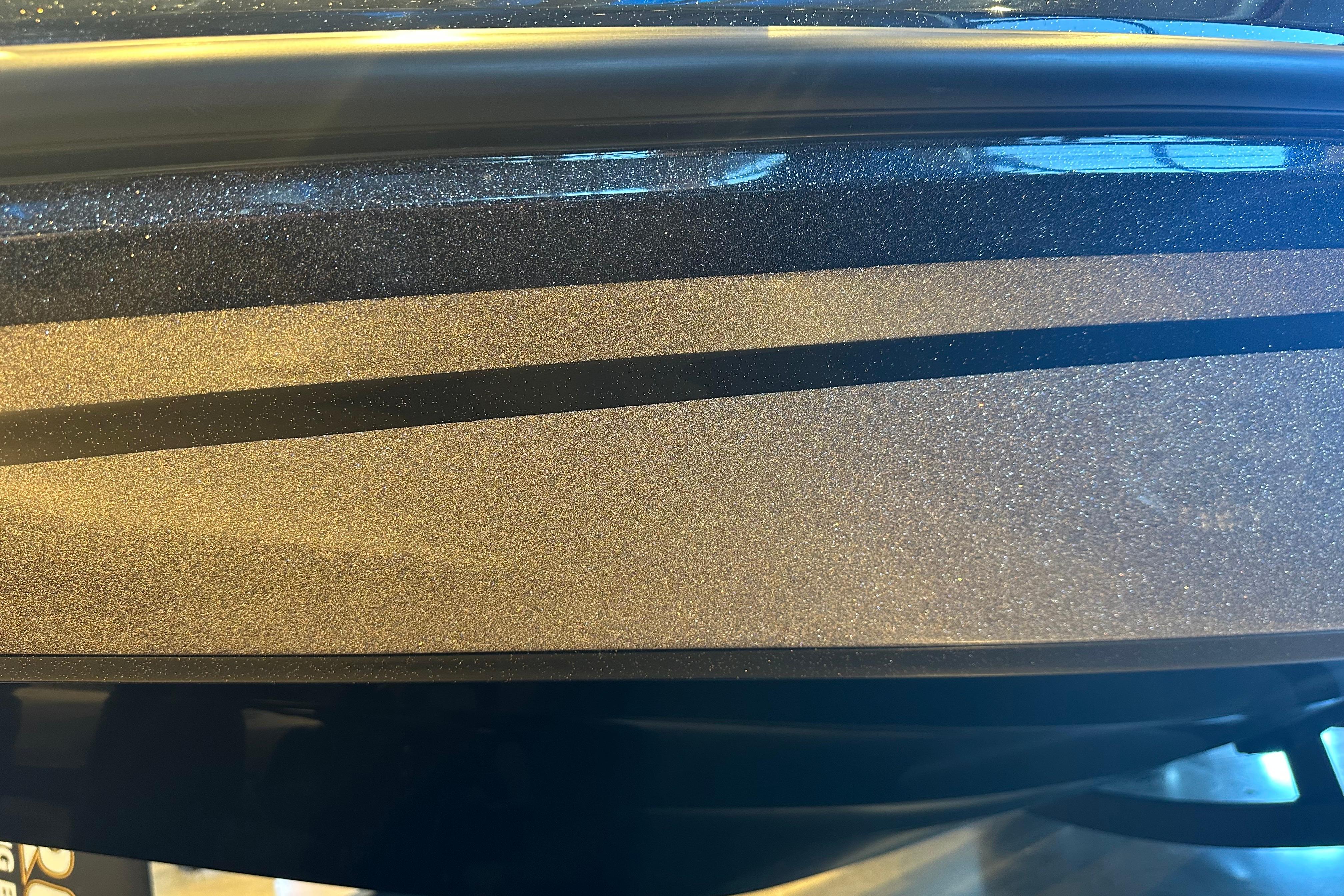 Close-up of 2026 Nitro Z19 XL boat's metallic finish with sleek design.
