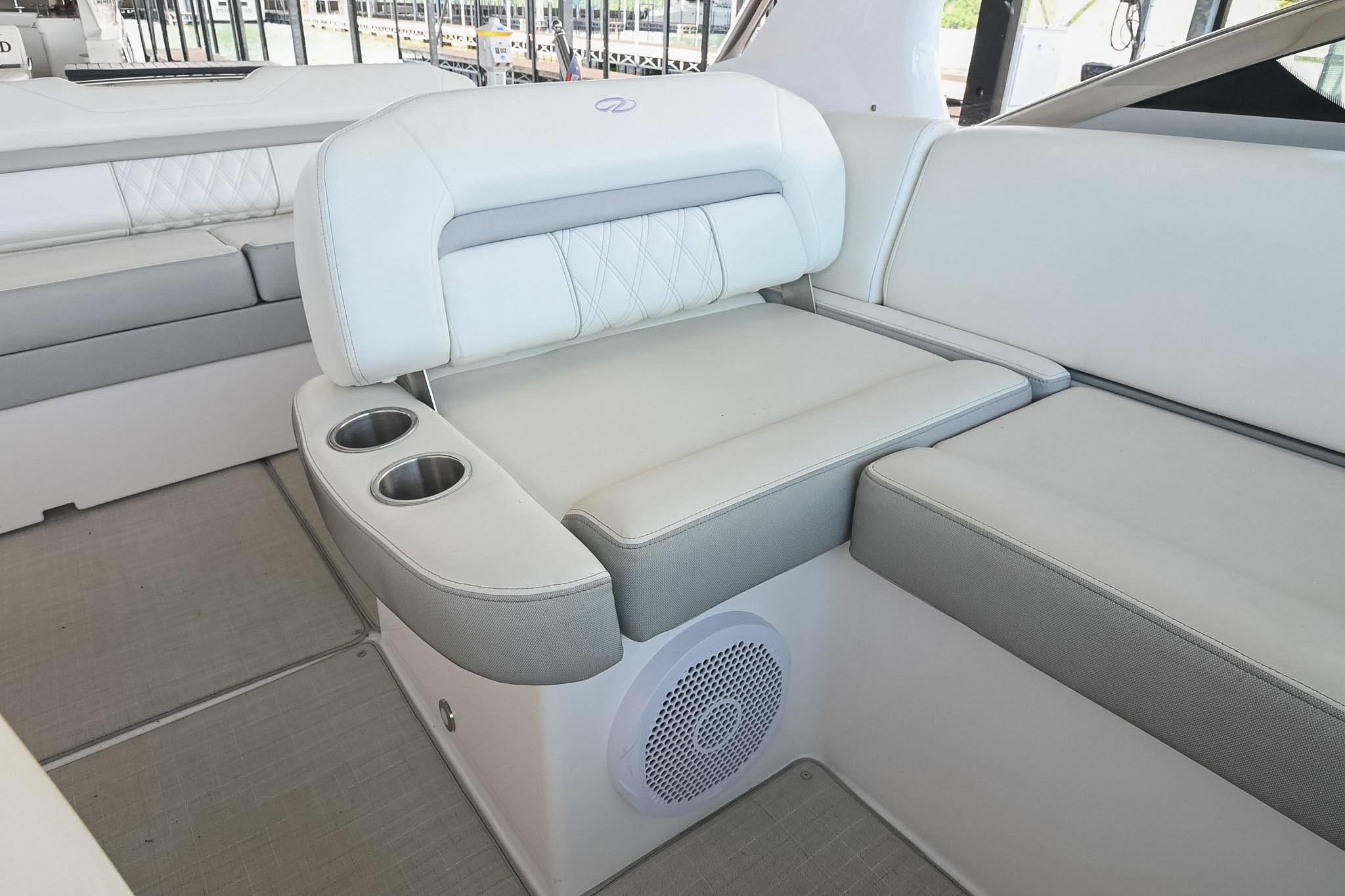 2021 Regal 33 Express boat interior with white seating and cup holders.