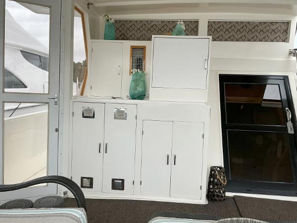 Interior of 2000 Novatec Islander 55 yacht with white cabinets and decor.