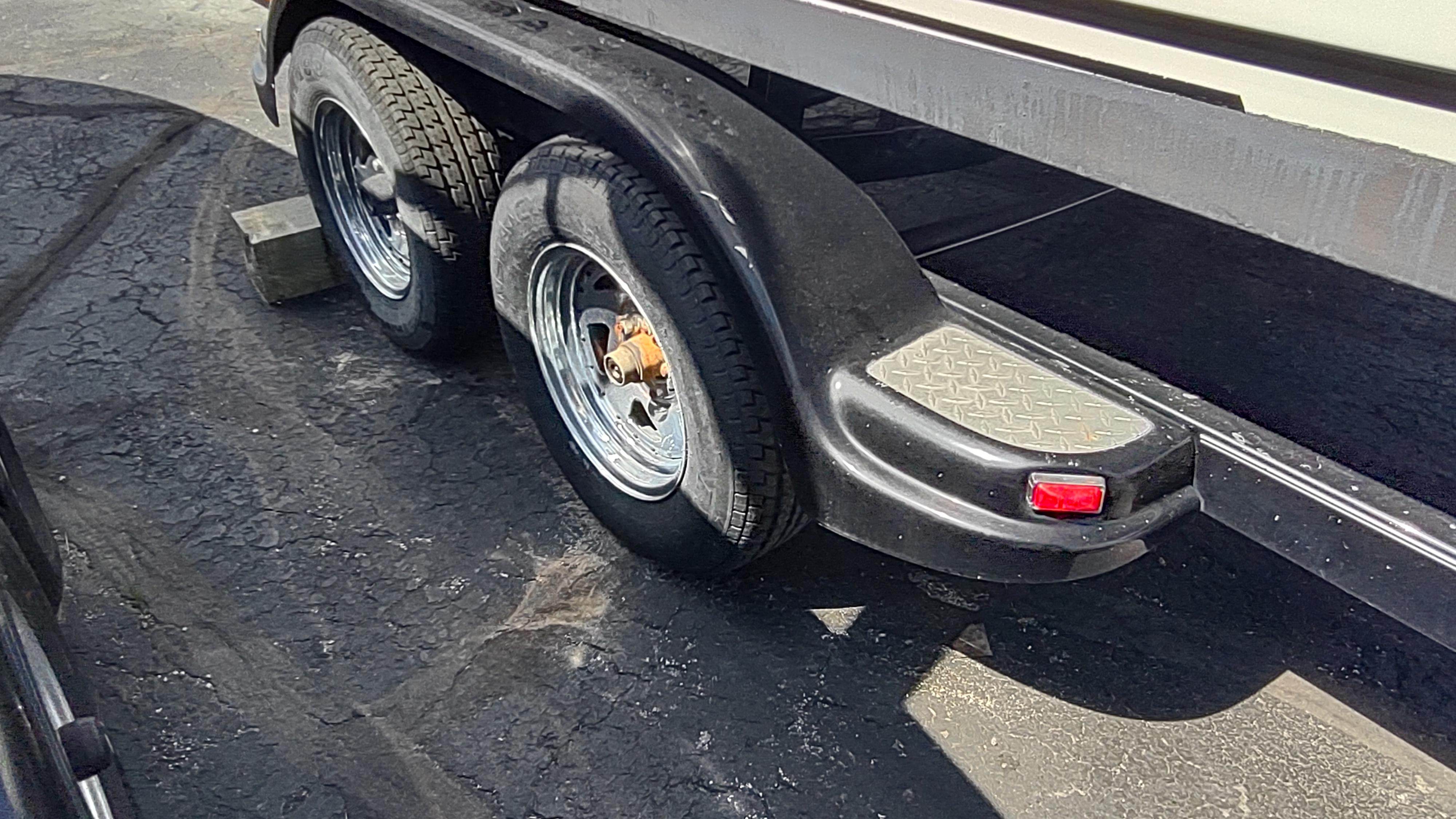 Trailer with dual wheels for 2001 Robalo 2020 Center Console boat.