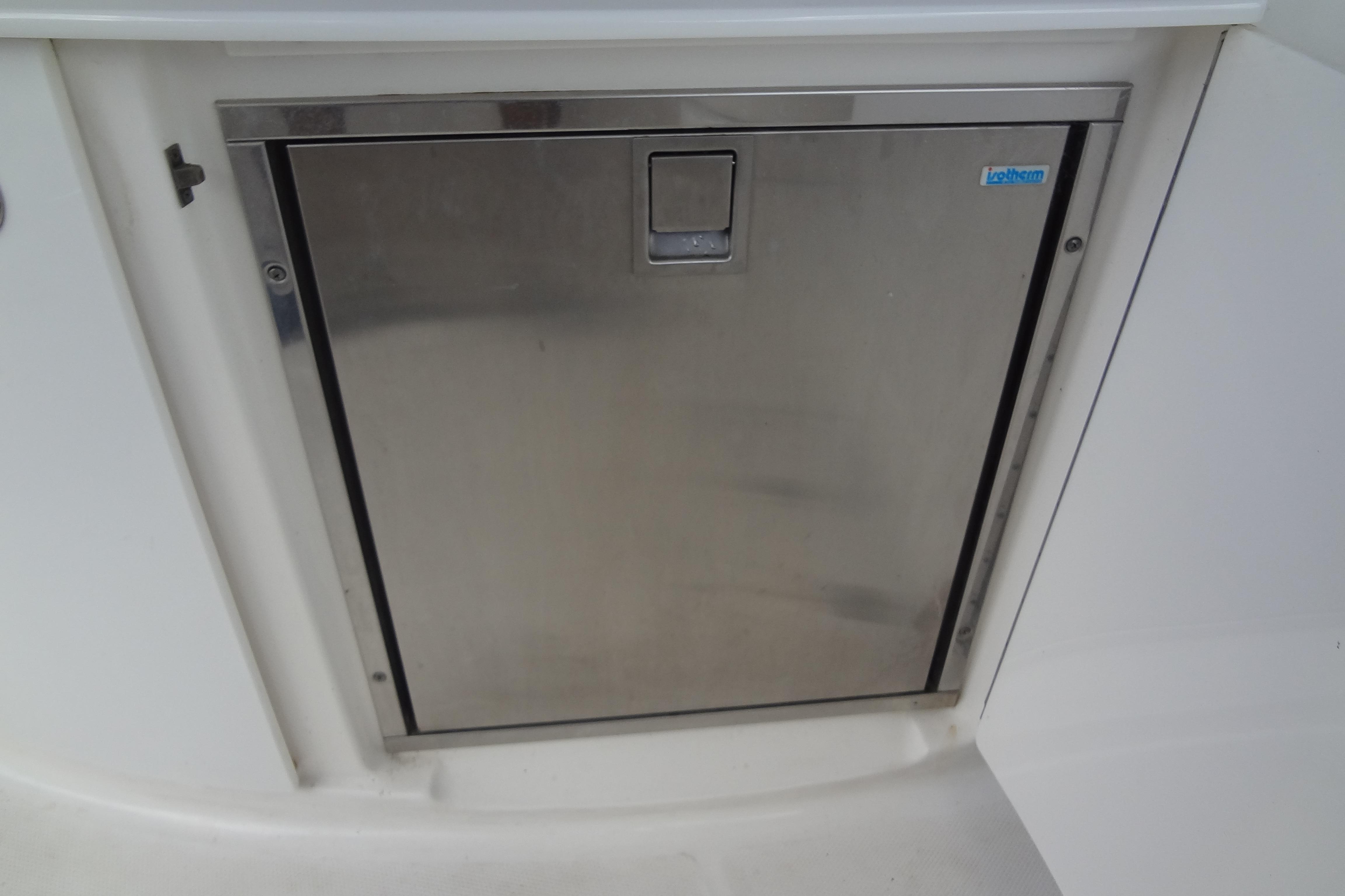 Stainless steel compartment door on 2008 Chaparral 276 SSX boat.