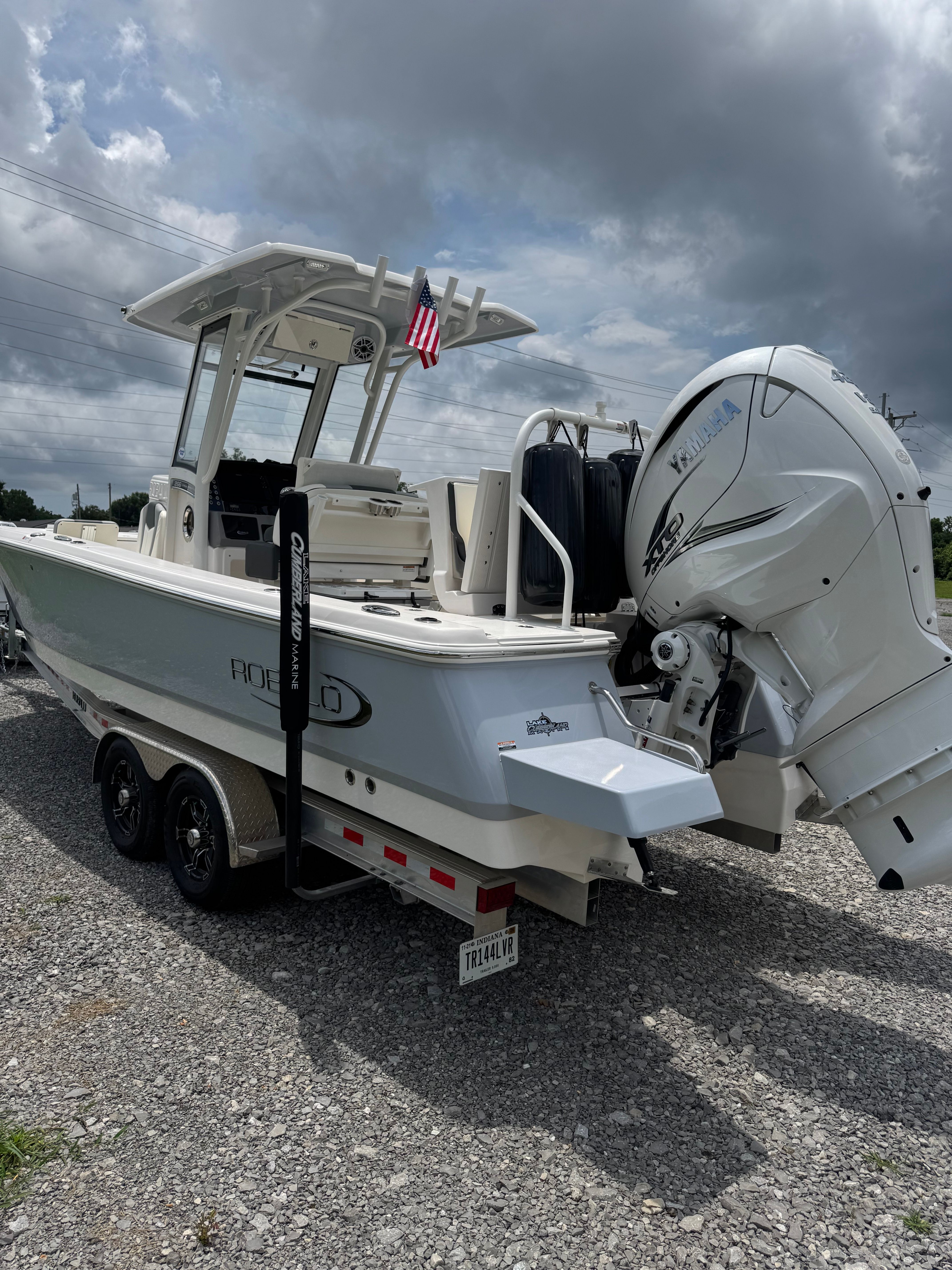 Robalo 266 Cayman boat on a trailer with an outboard motor, ready for use.