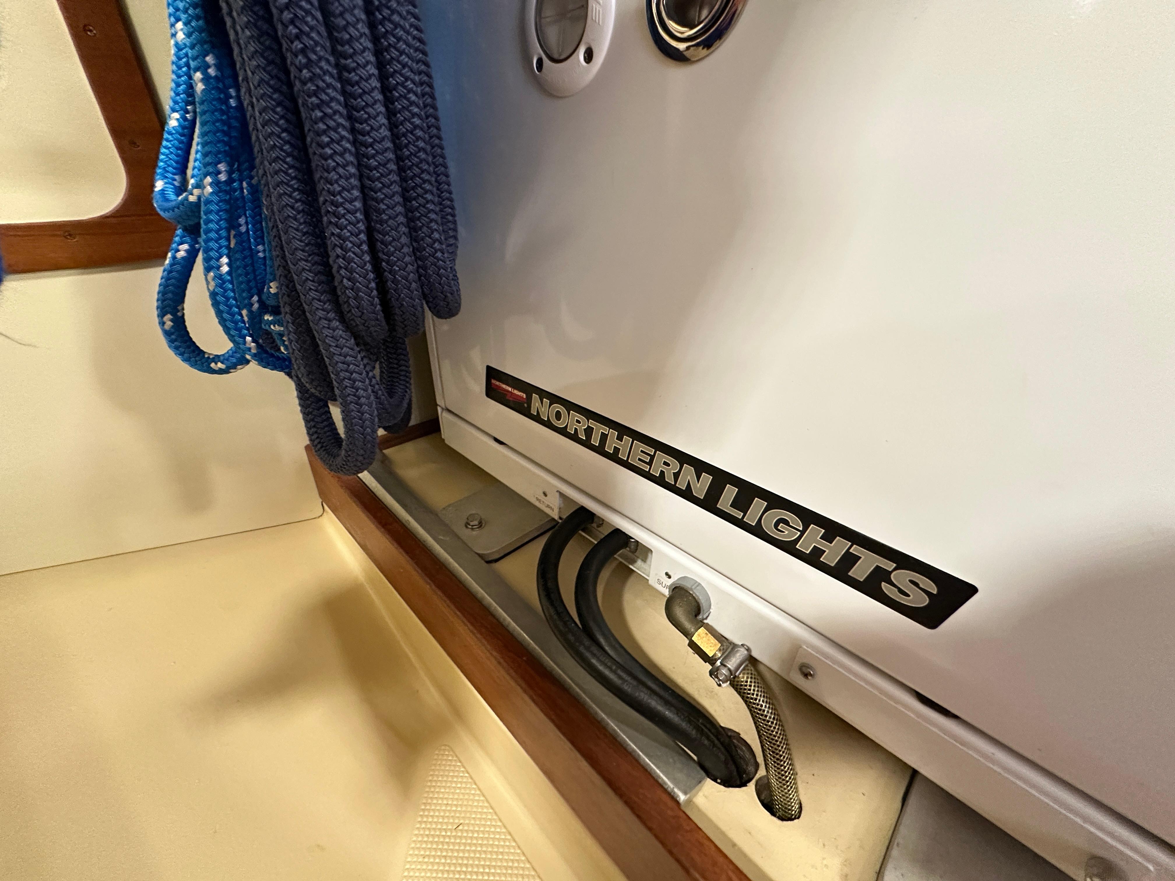 Coiled blue rope and Northern Lights generator on 2021 Island Packet 439 yacht.