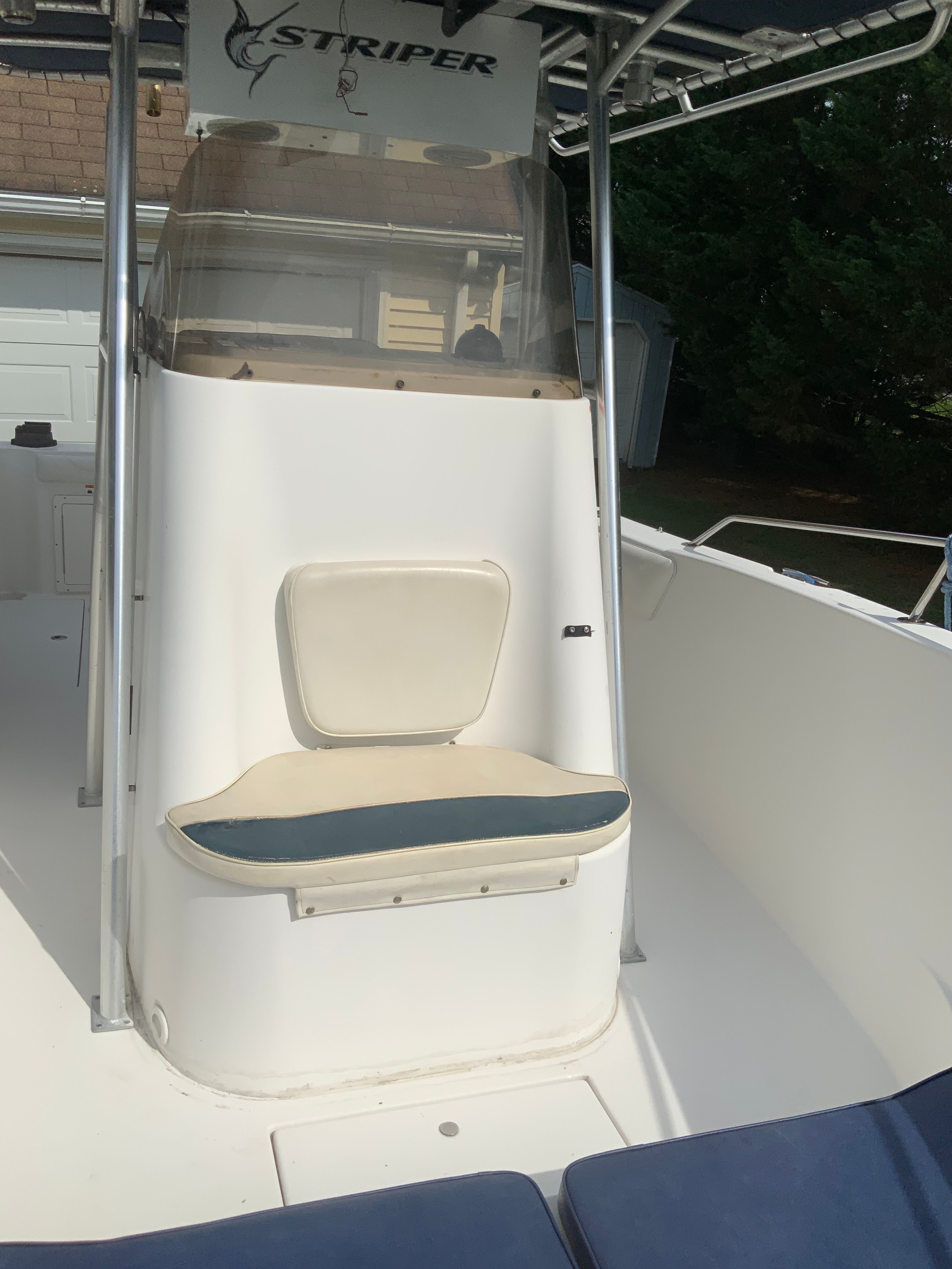 The image shows the cockpit of a 2006 Seaswirl Striper 26 with a seat and helm.