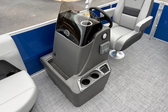2026 Sun Tracker Party Barge 16 DLX interior with steering console and seating.
