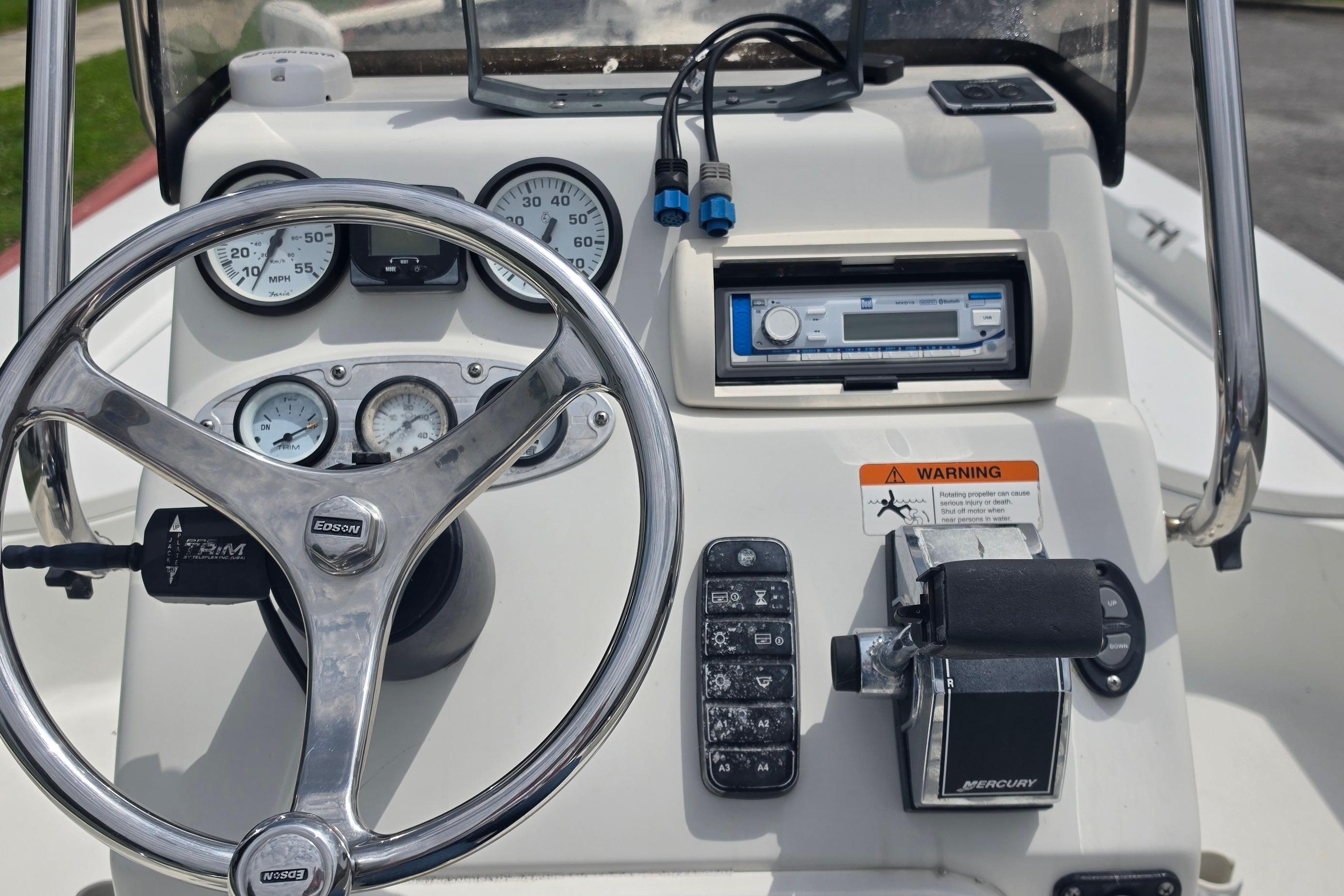 2009 Ranger 2200 Bay Ranger boat dashboard with steering wheel and control panel.