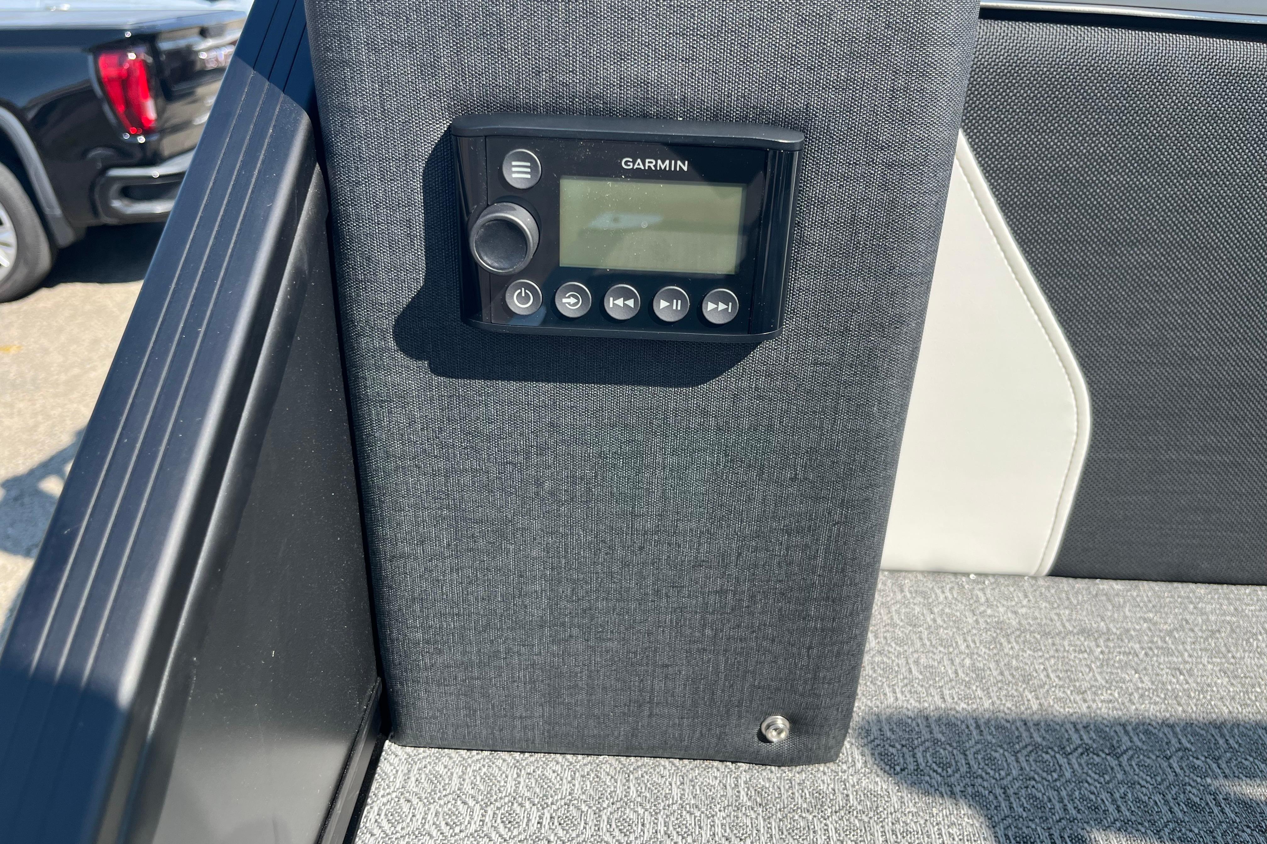 Garmin device on Evotti 725CS boat interior, 2026 model, with textured upholstery.