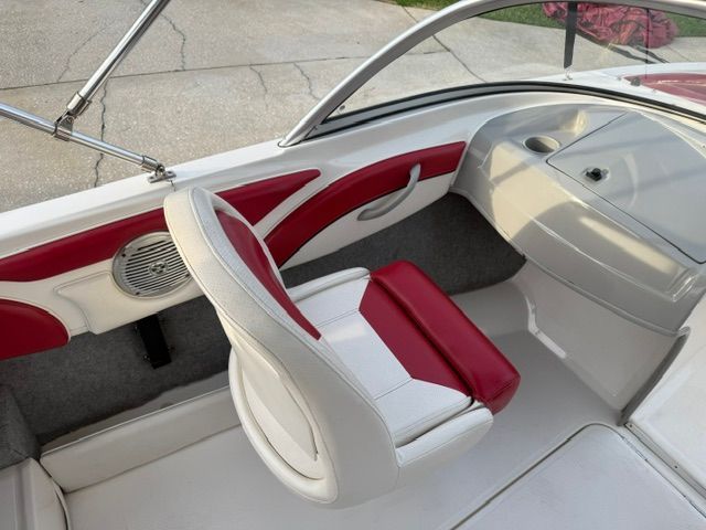 Interior of a 2012 Bayliner 184 SF with red and white seats.
