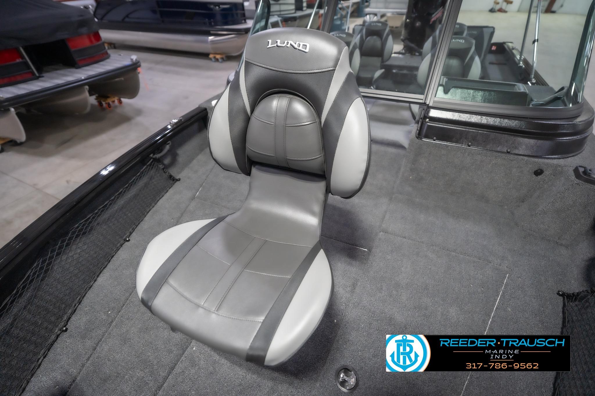 2026 Lund 2075 Impact XS boat seat in a showroom setting.