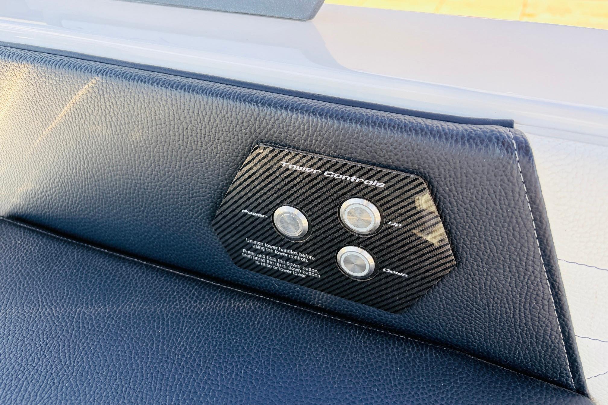2023 Nautique Super Air Nautique G25 tower controls on black leather panel.